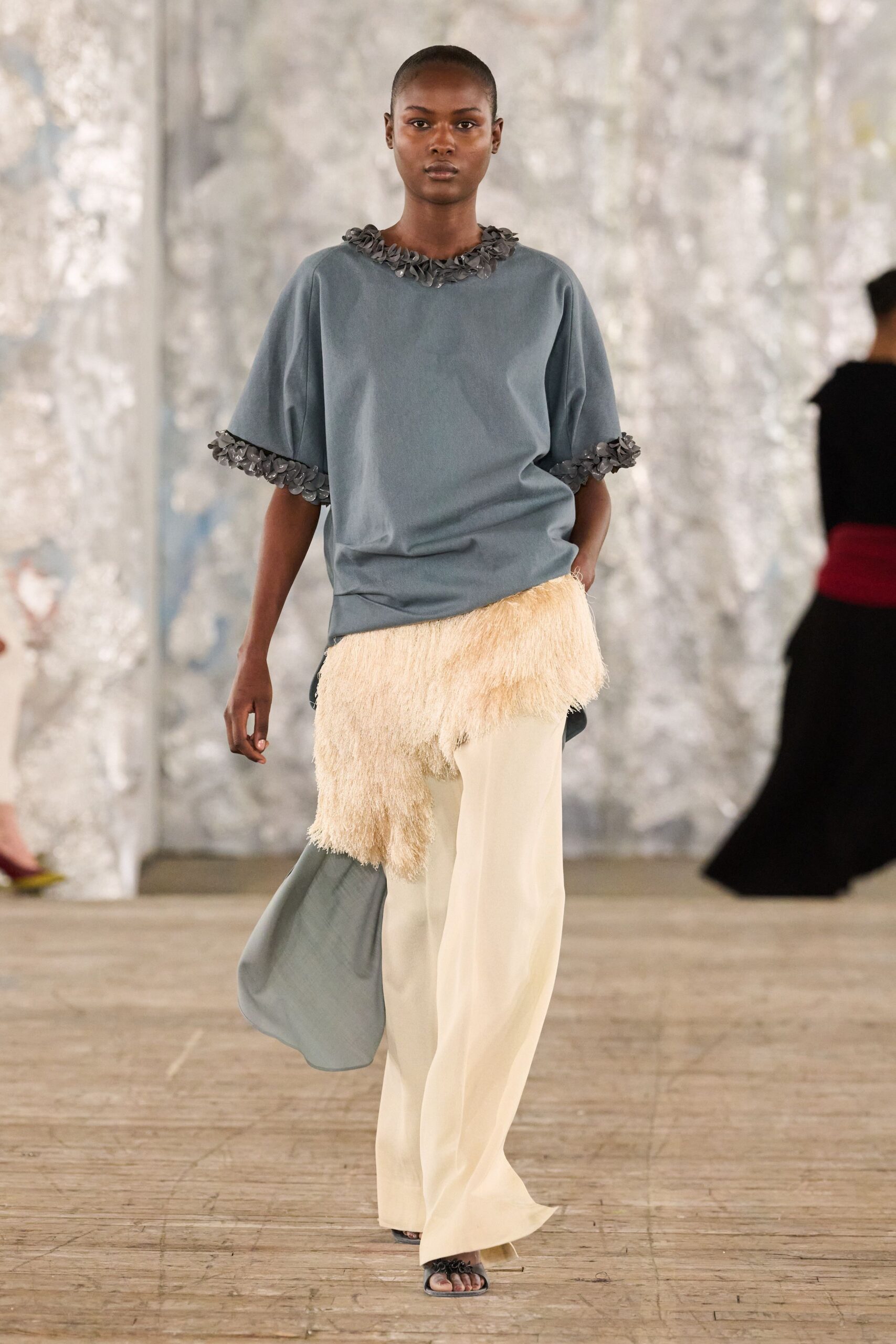 blue relaxed top with beige pants