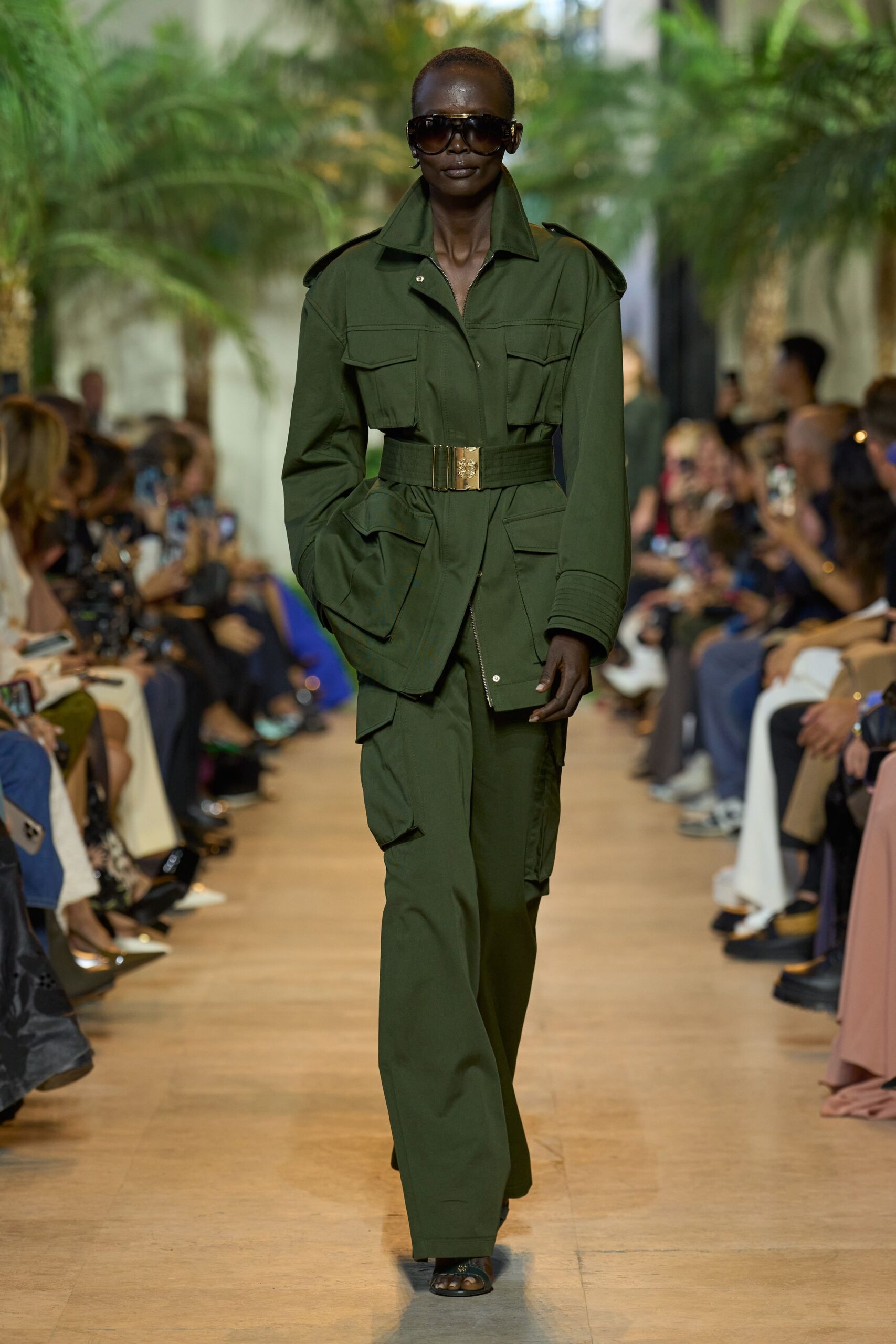 green fitted jacket with wide-leg pants