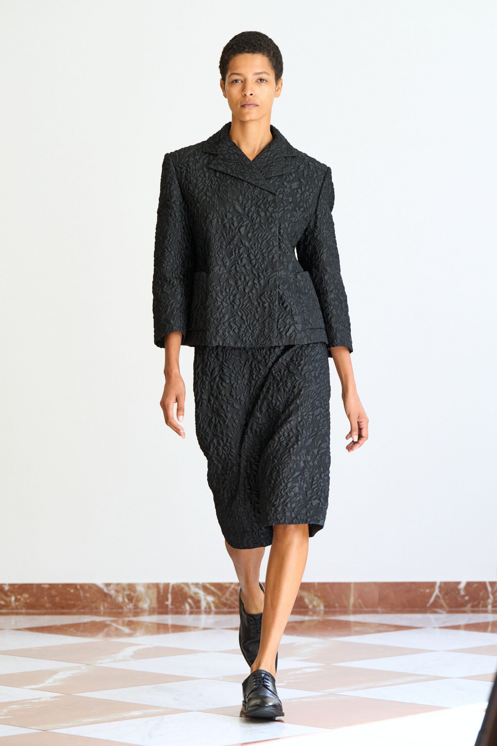 black cotton long-sleeve collared structured textured blazer