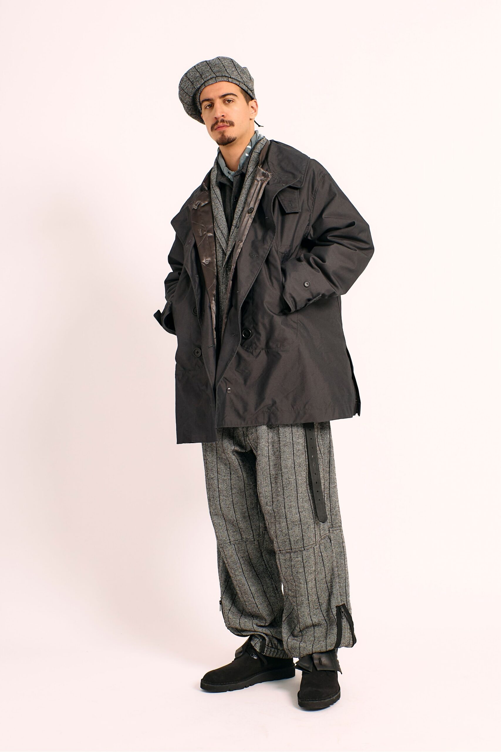 black coat gray pants hat shoes