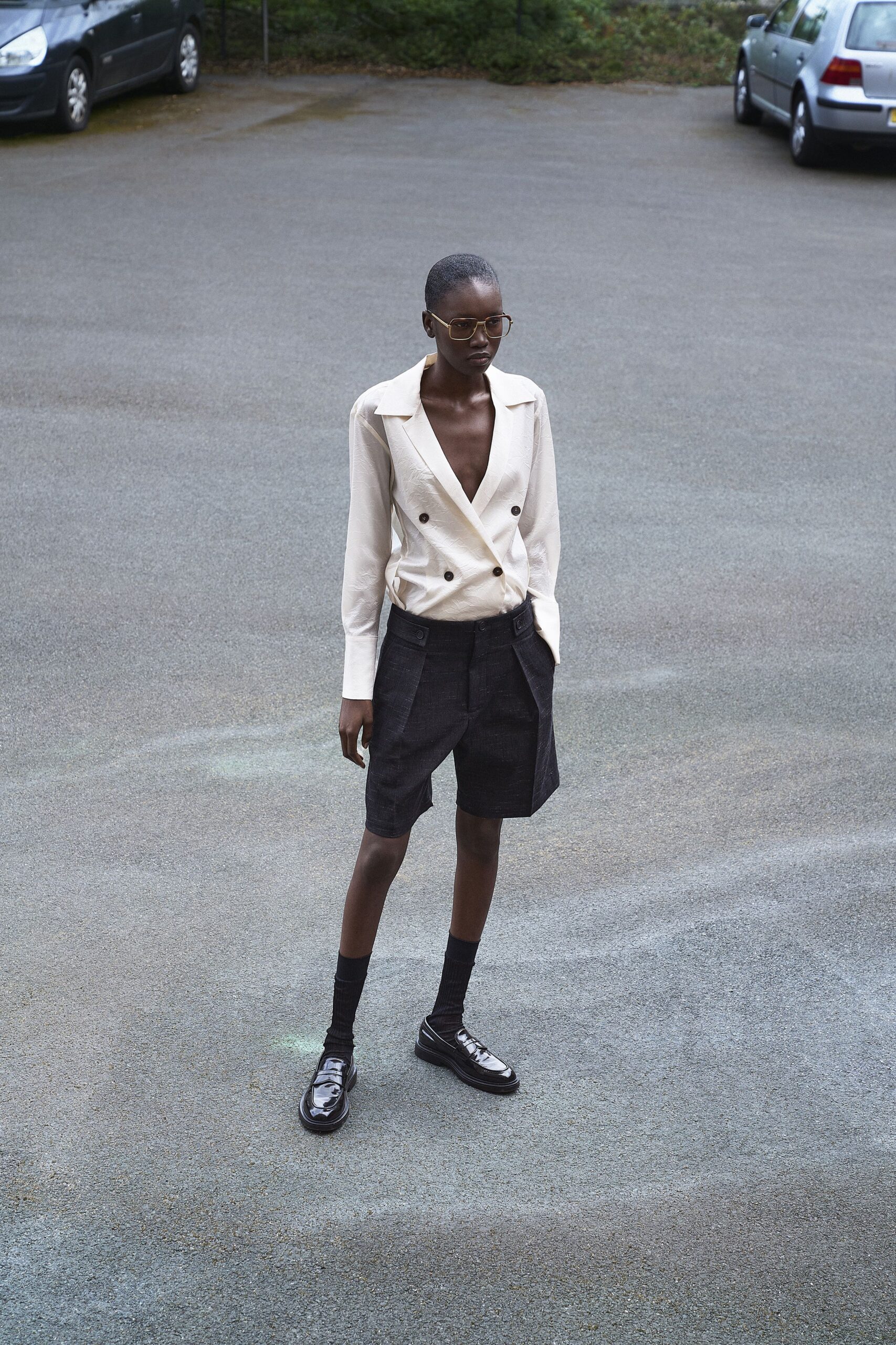beige tailored blazer black shorts