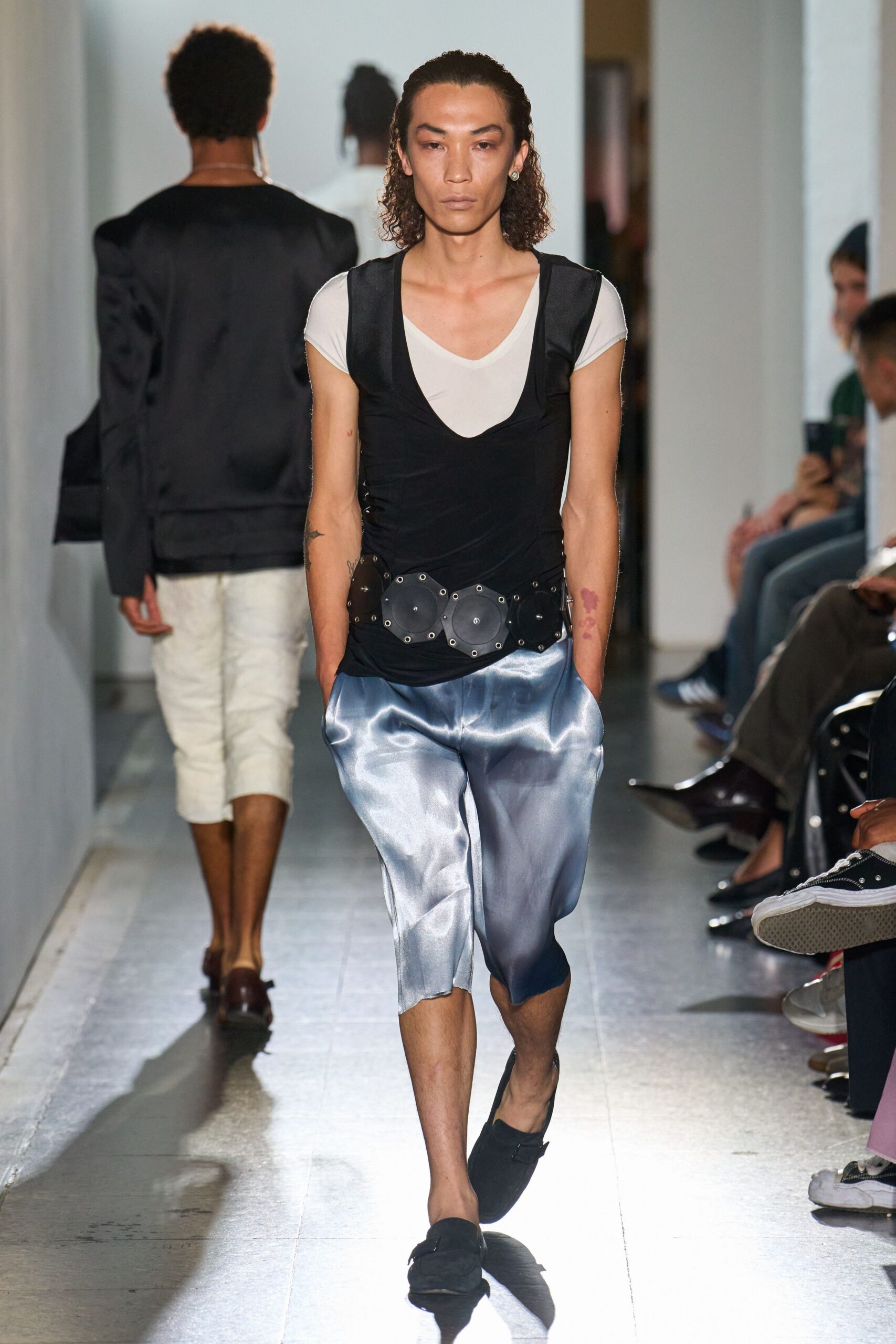 black fitted top with blue pants