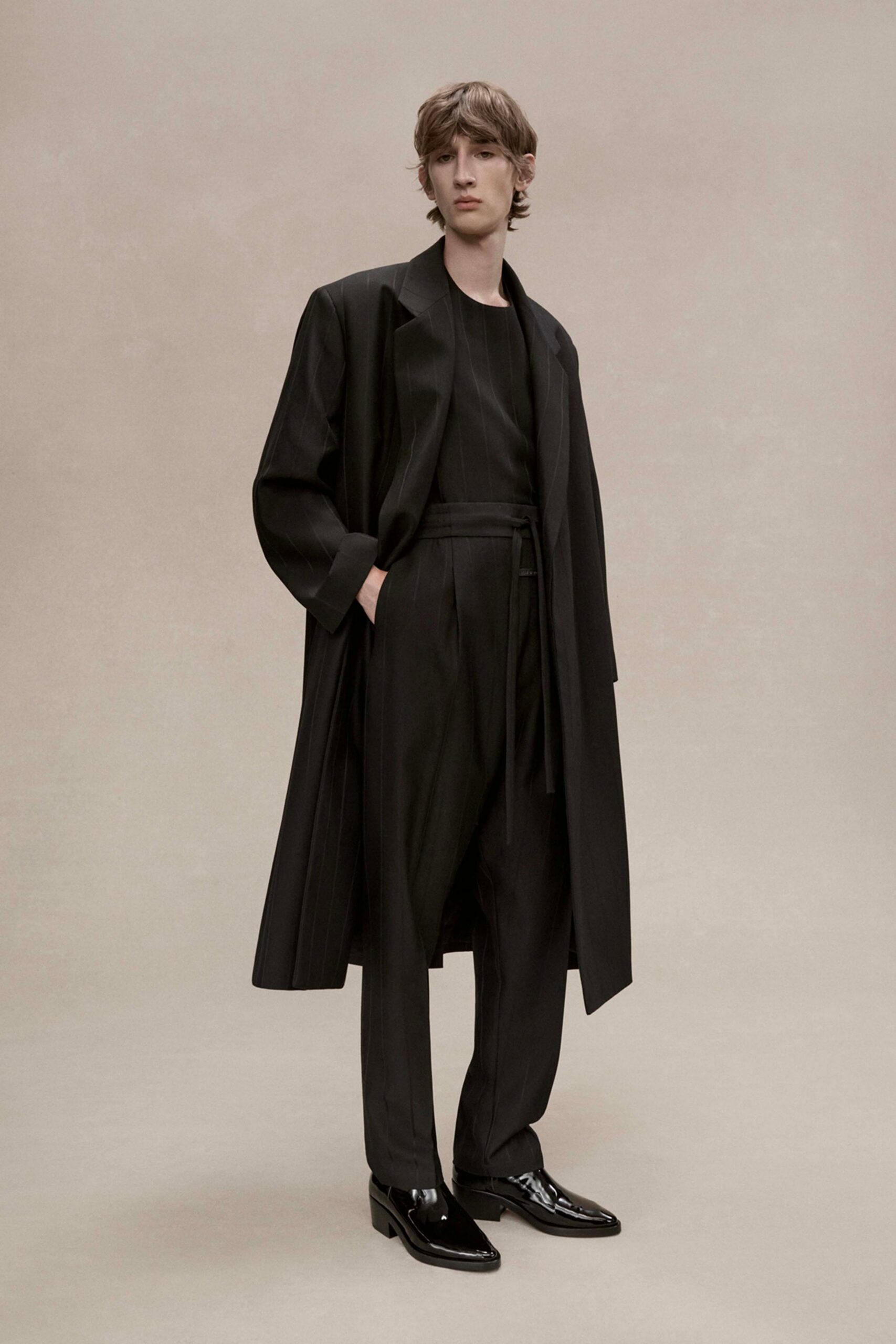 black wool long-sleeve relaxed buttoned coat
