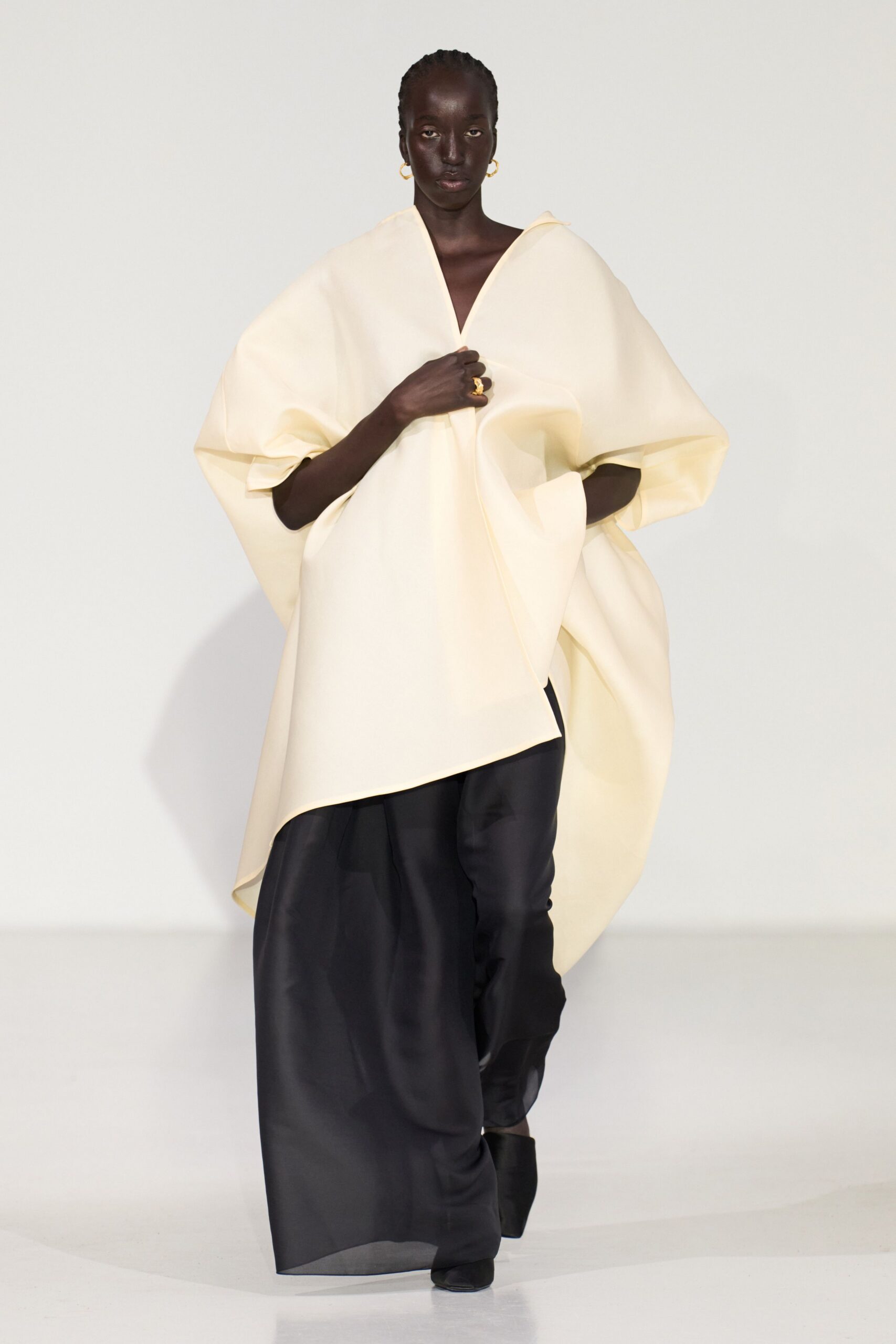 white cotton cape with black pants