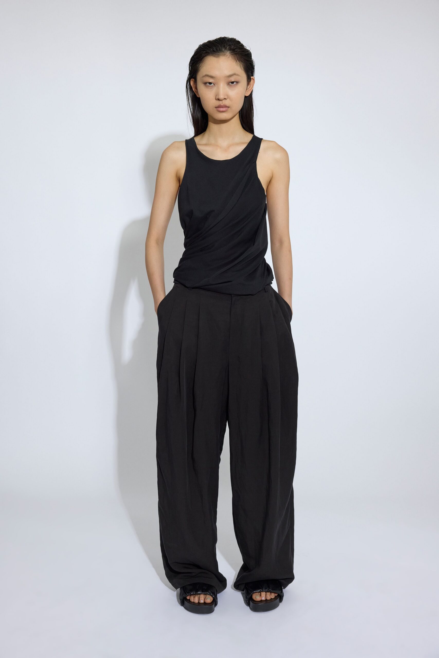 black tank-top and relaxed pants