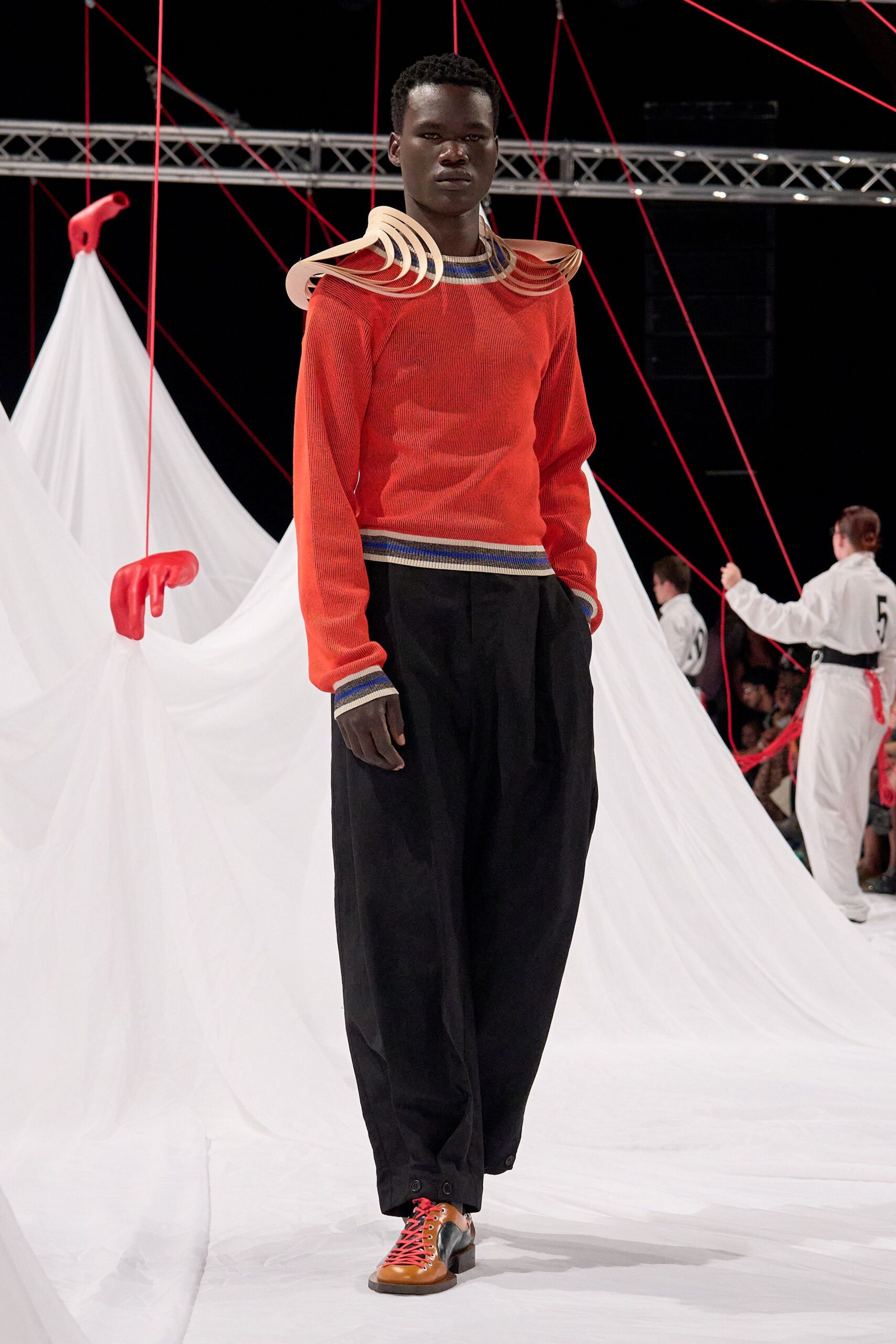 orange relaxed sweater with black pants