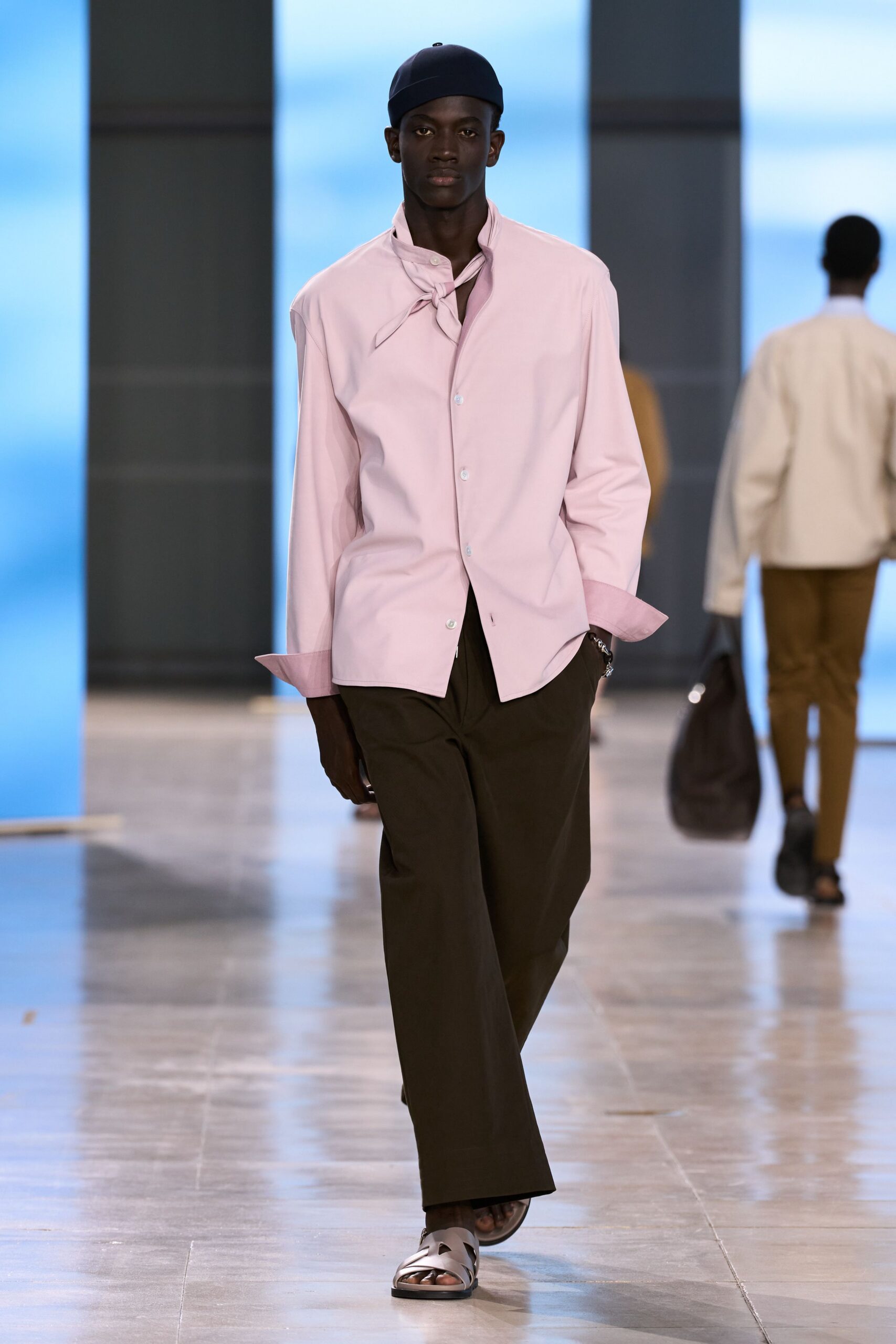 pink shirt brown pants white shoes