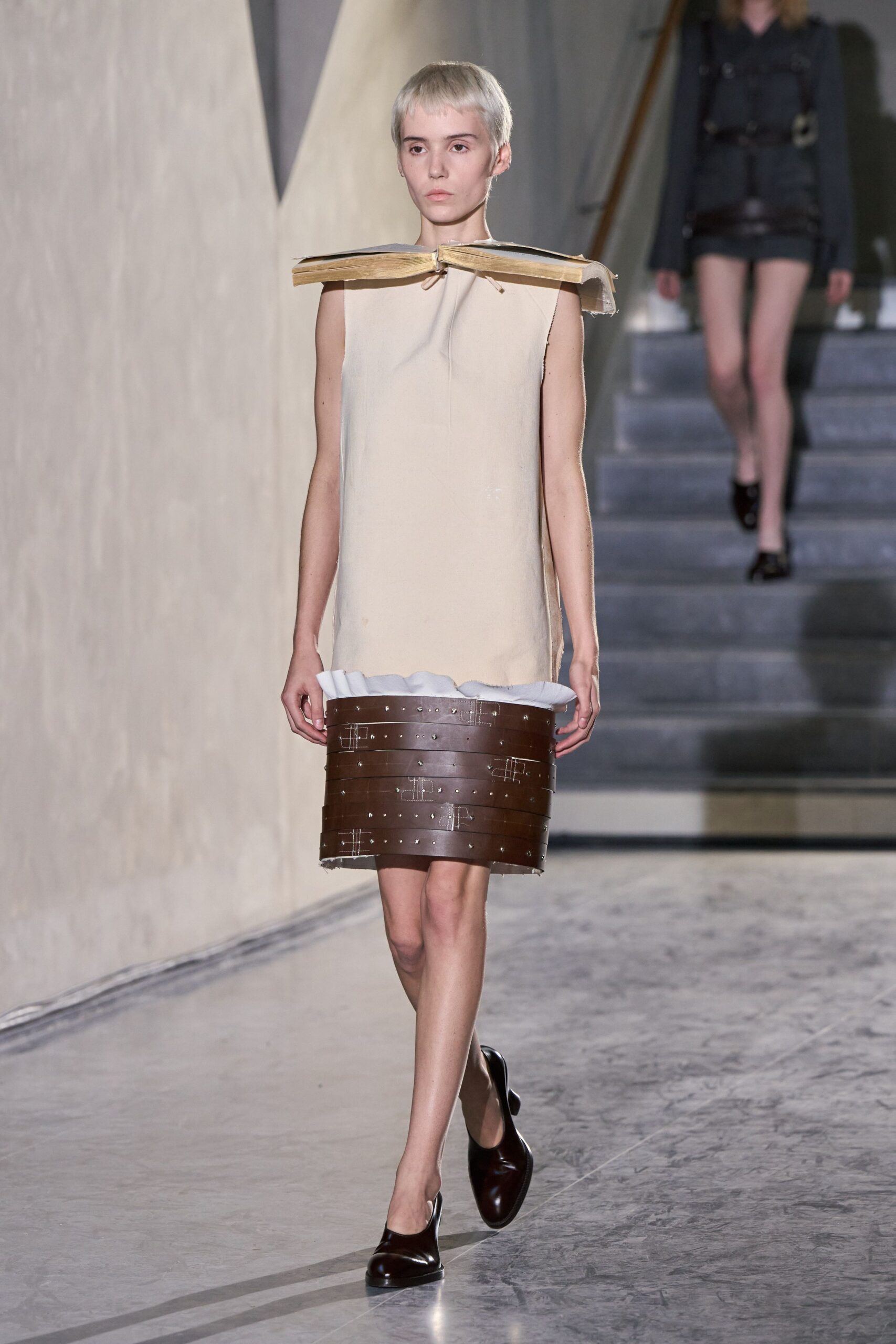 beige layered mini dress with black shoes