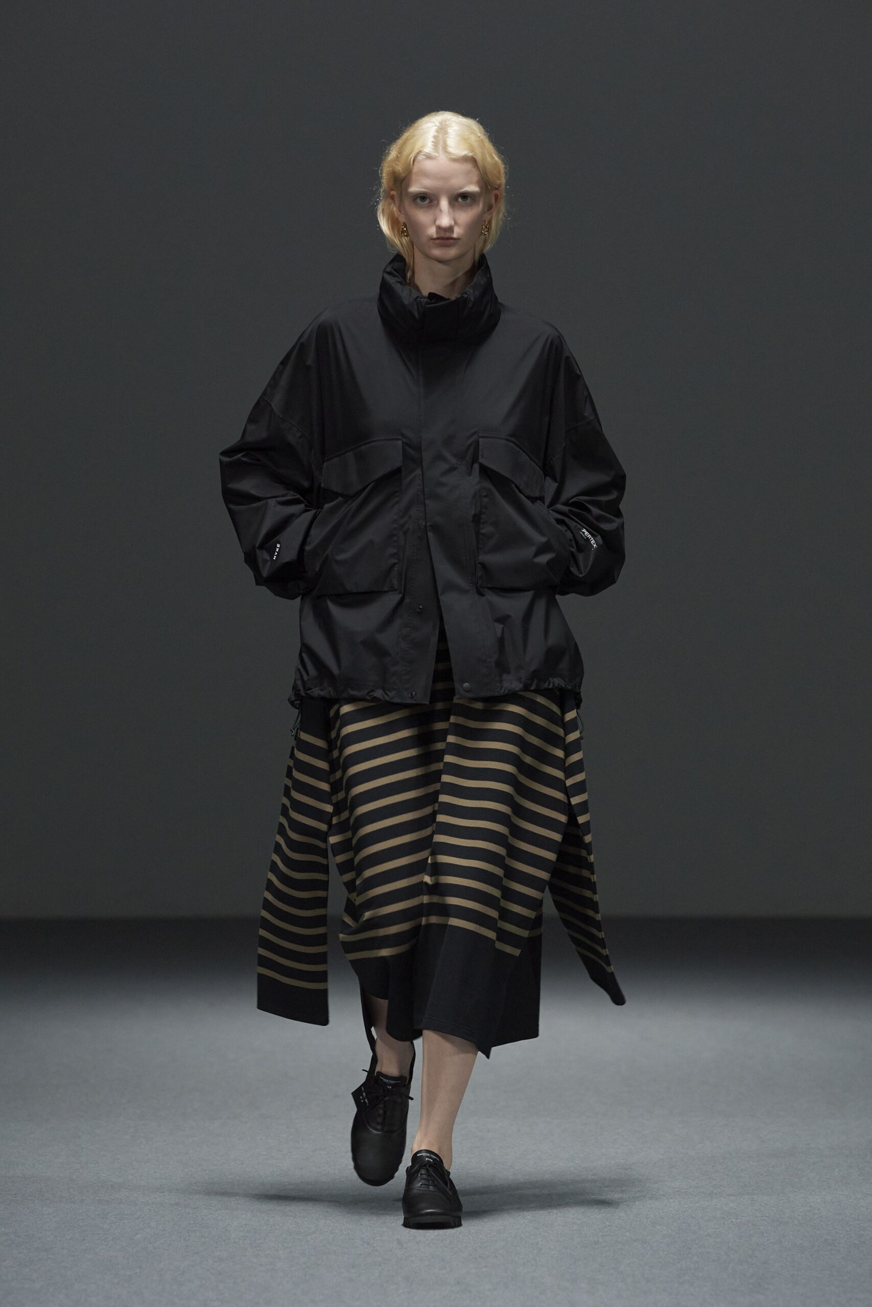 black relaxed jacket with striped skirt