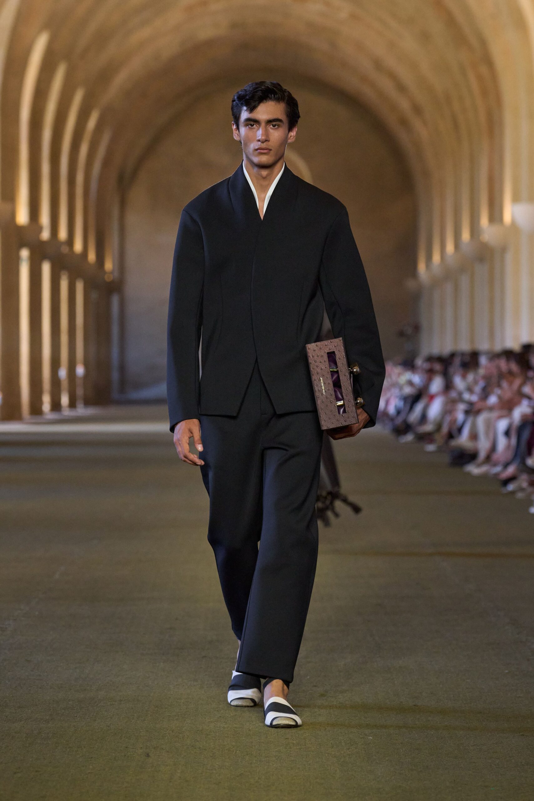 black tailored suit with purple bag