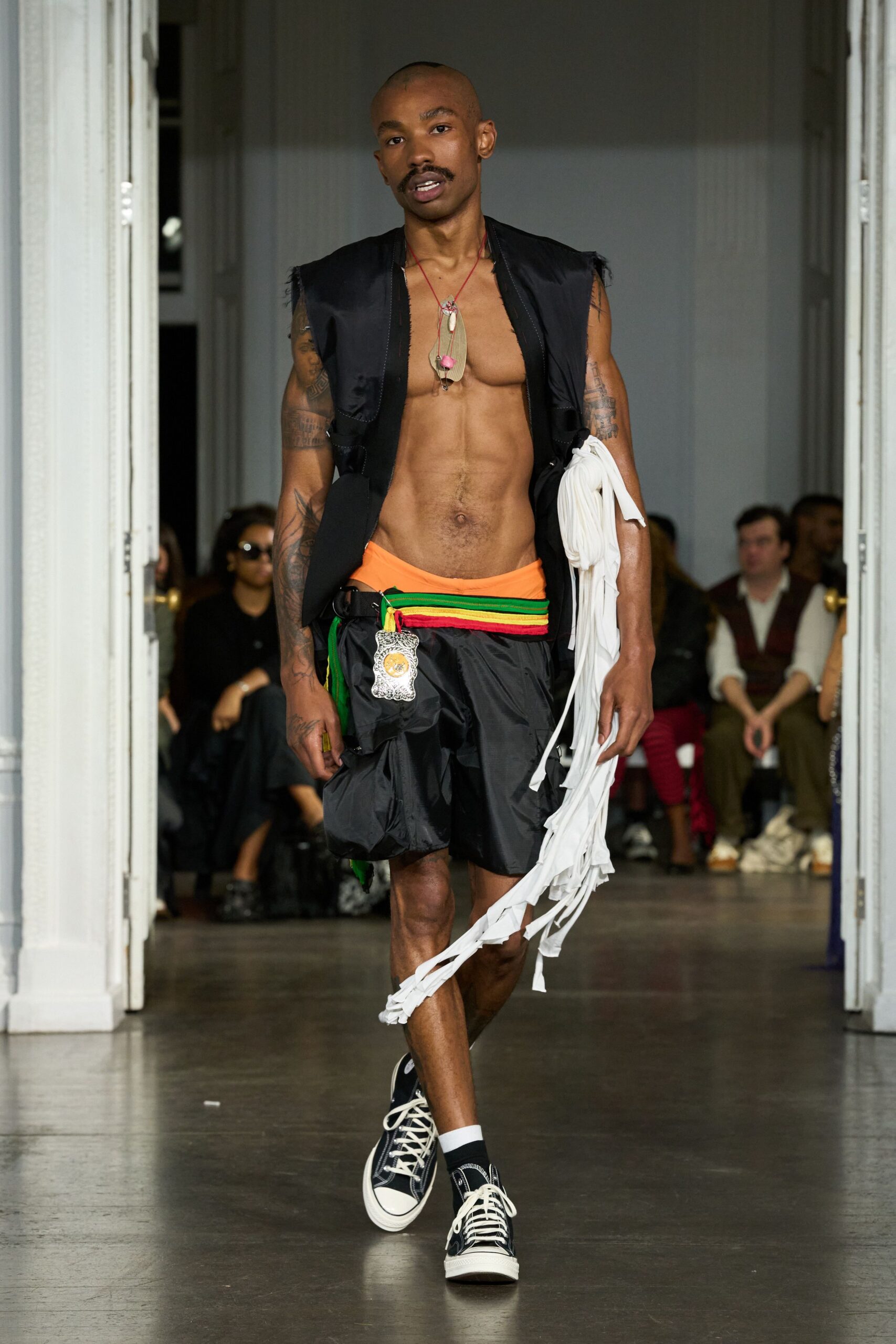 black vest orange shirt relaxed shorts