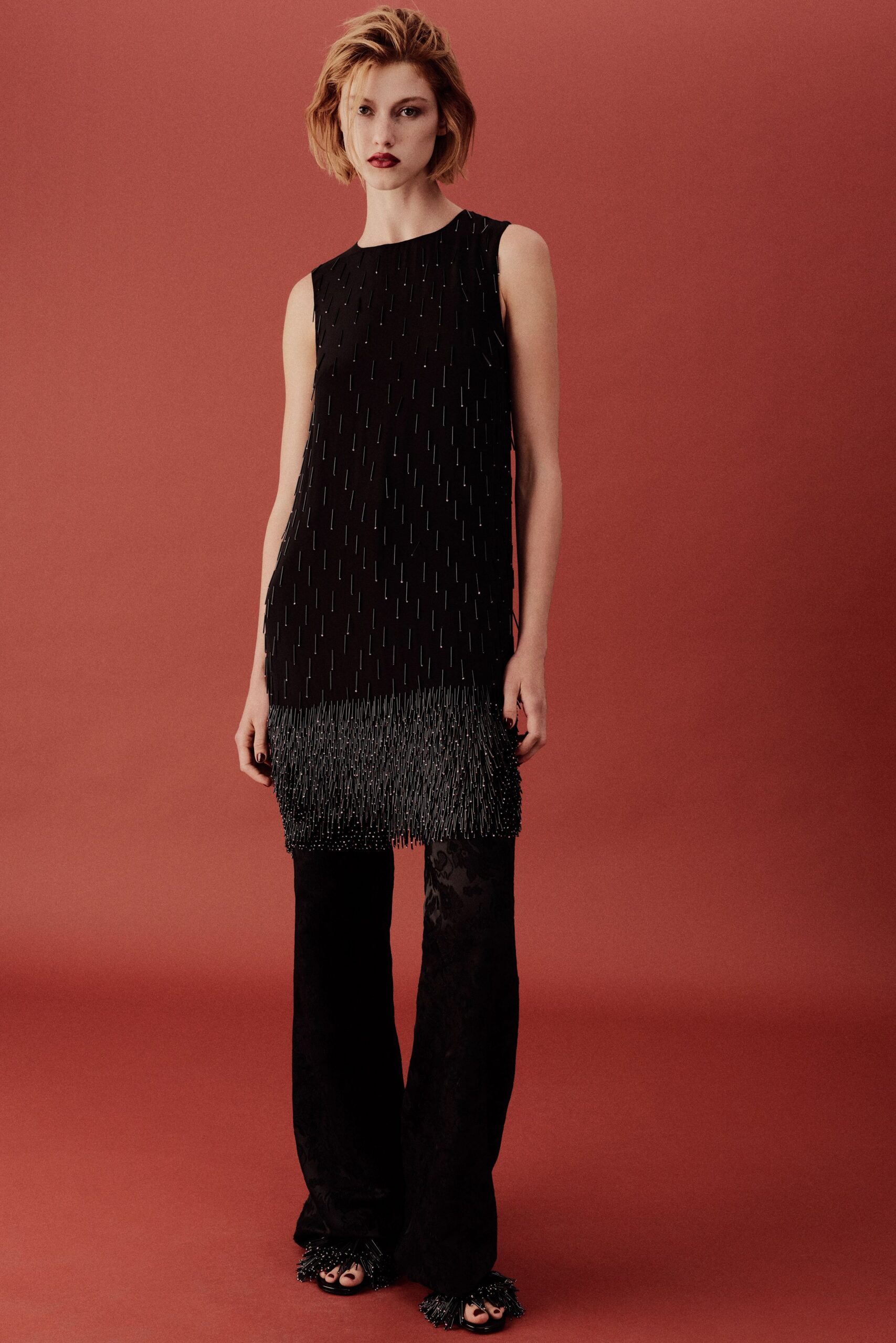 black silk sleeveless high-neck fitted ruffled top