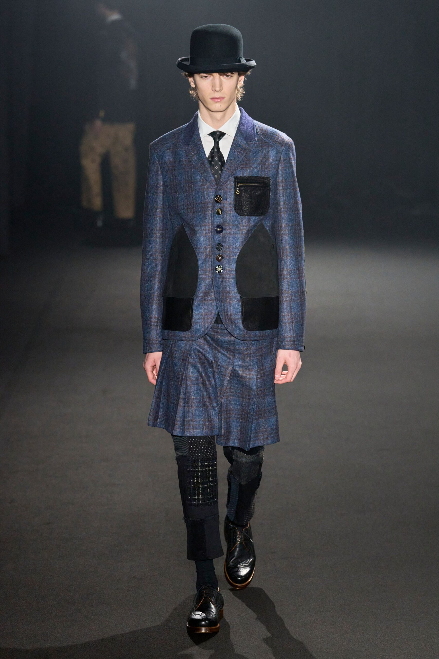 blue tailored suit with black accessories