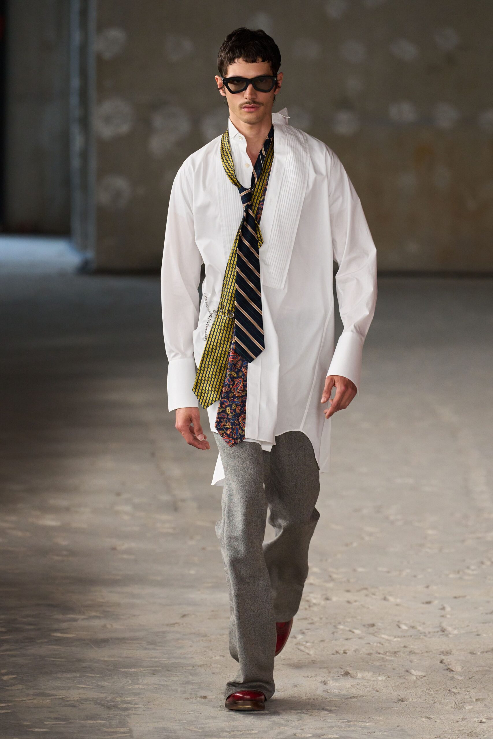 white relaxed shirt with gray pants