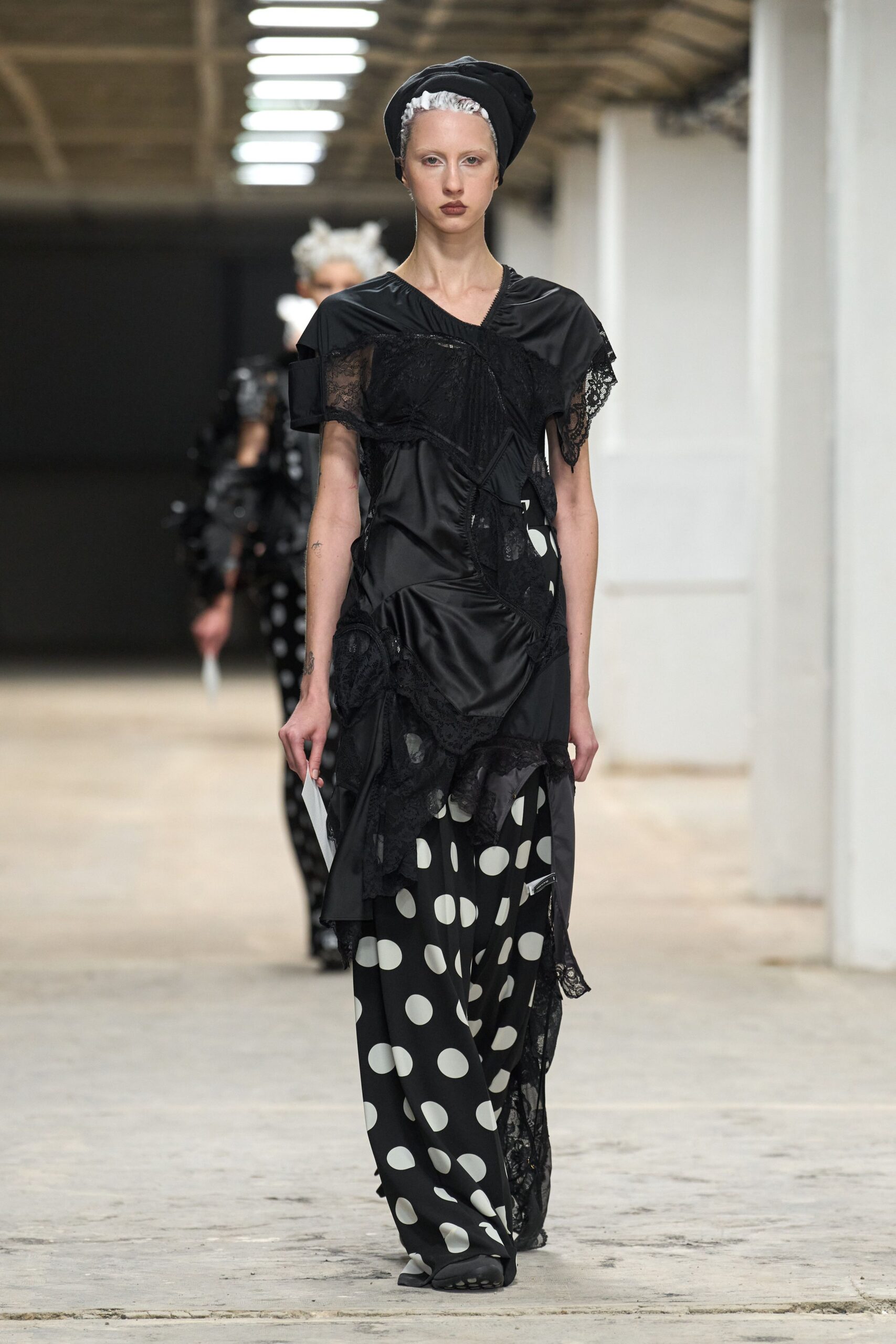 black silk top with polka-dot pants