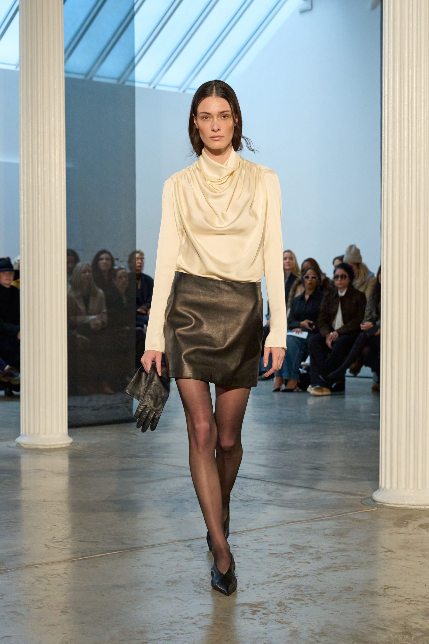 ivory silk blouse and black leather skirt