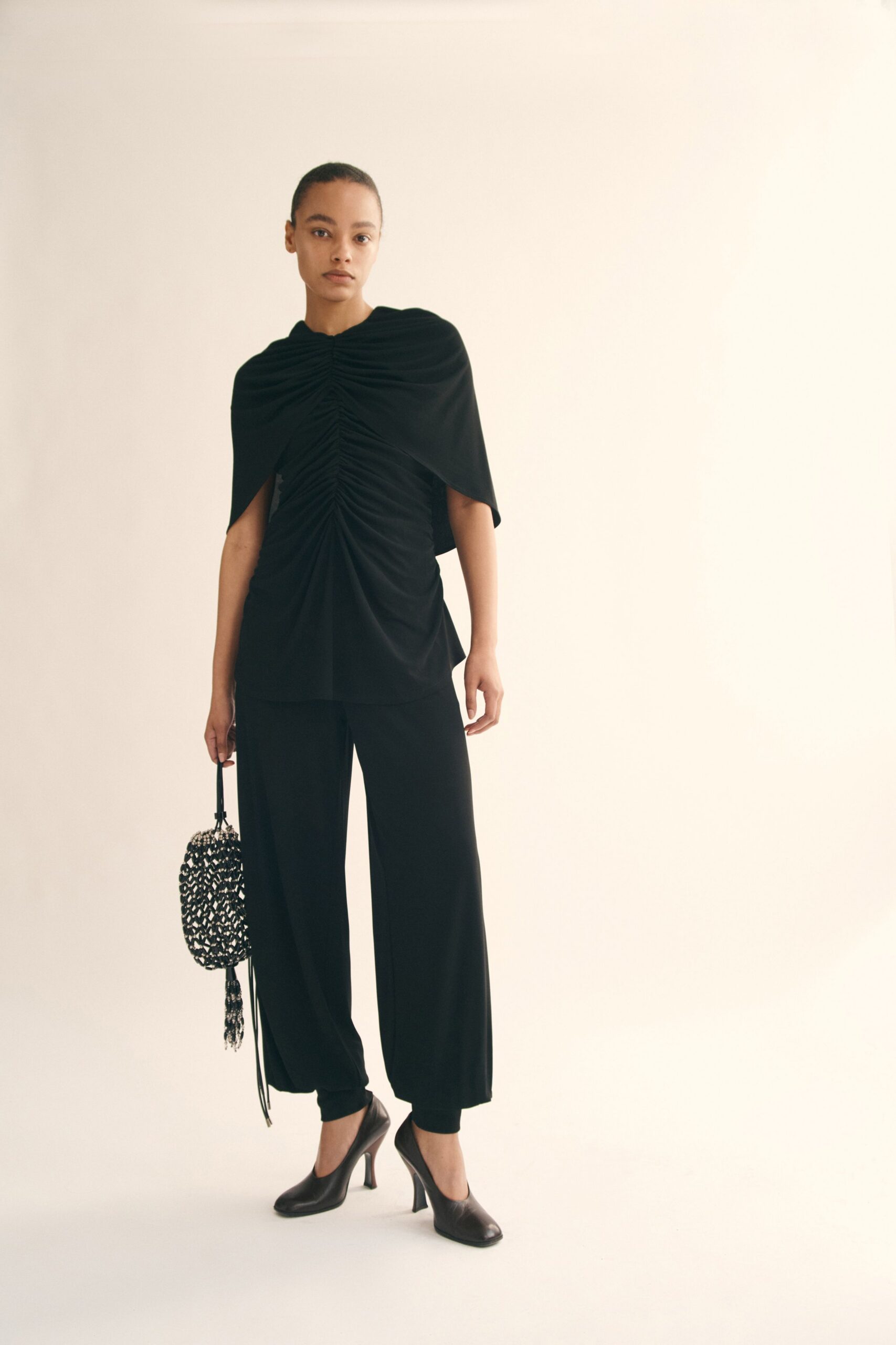 black fitted top with relaxed pants
