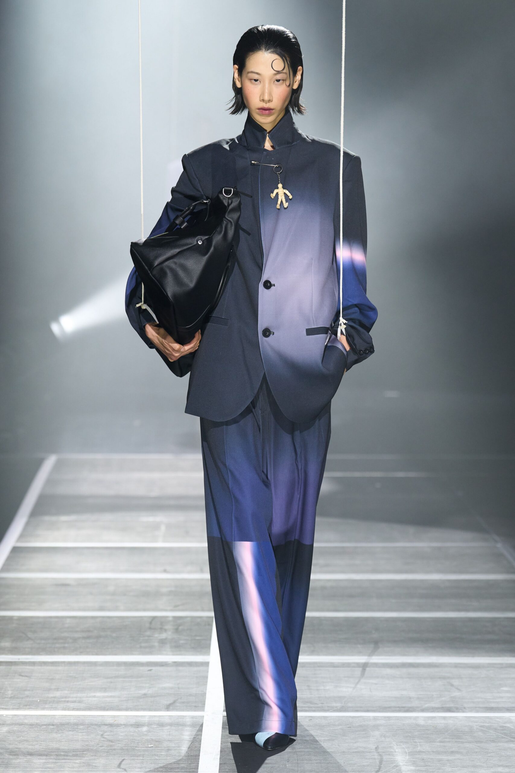 blue tailored suit with bag