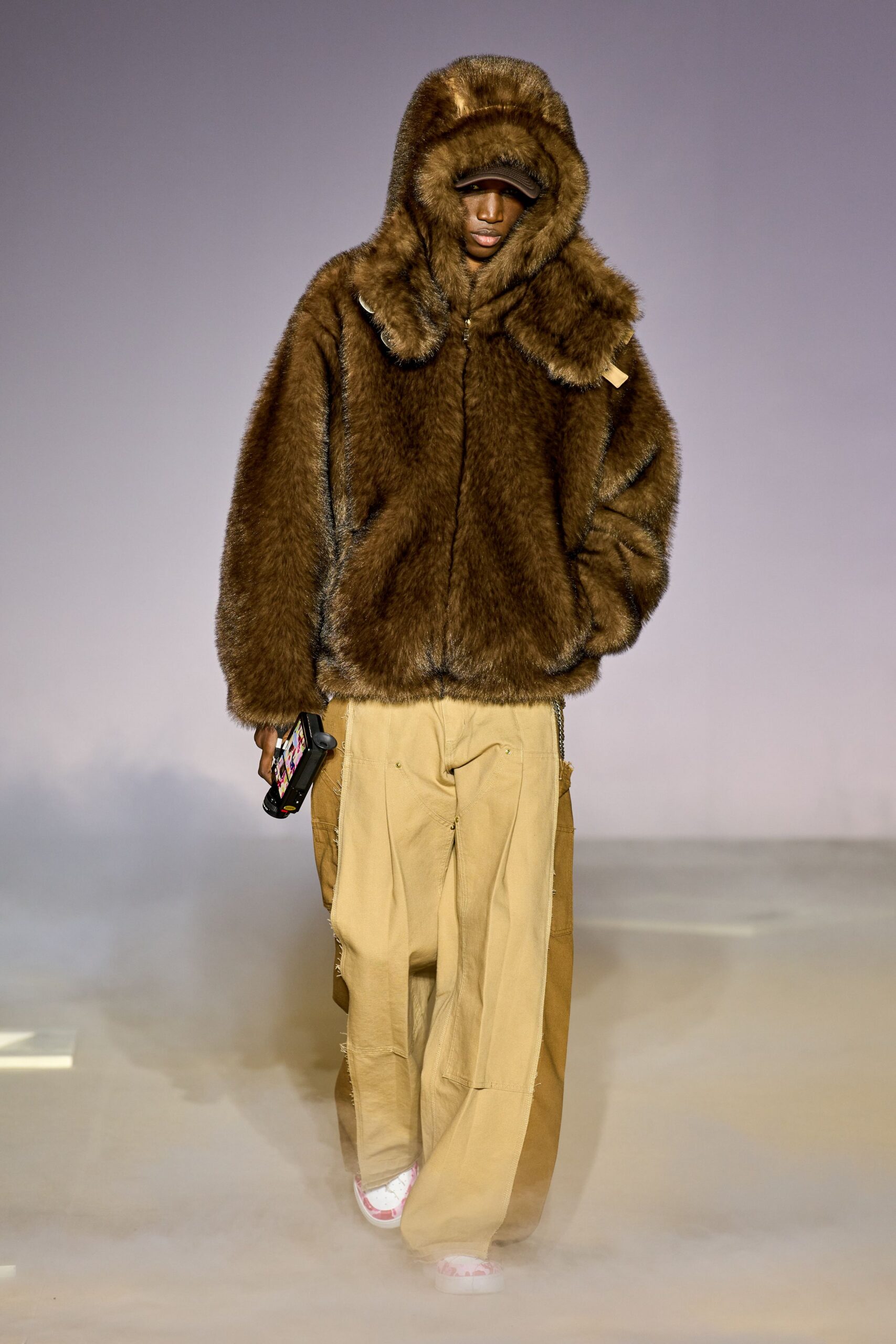 brown faux-fur jacket with beige cargo pants