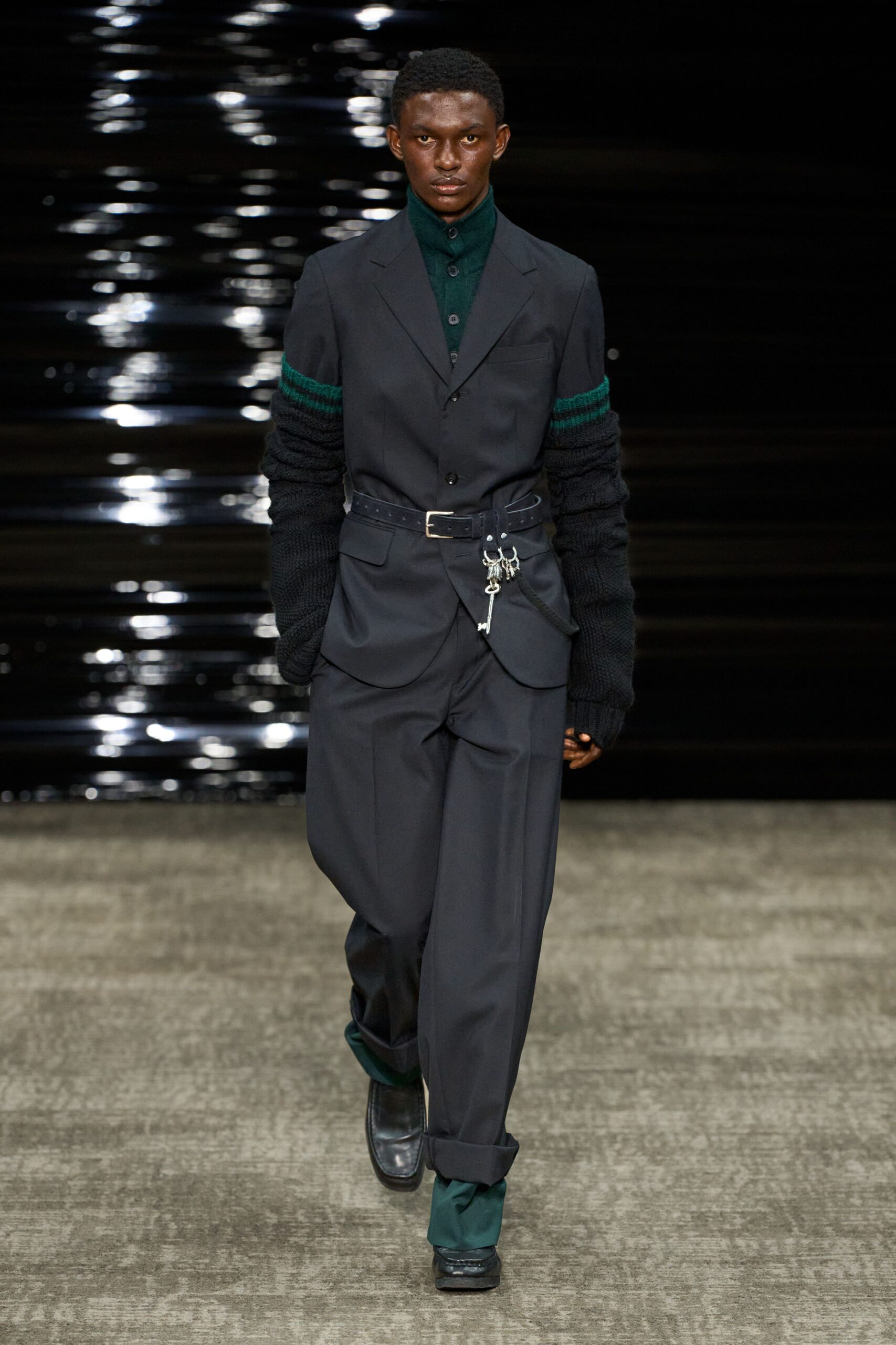 black tailored suit with green shirt