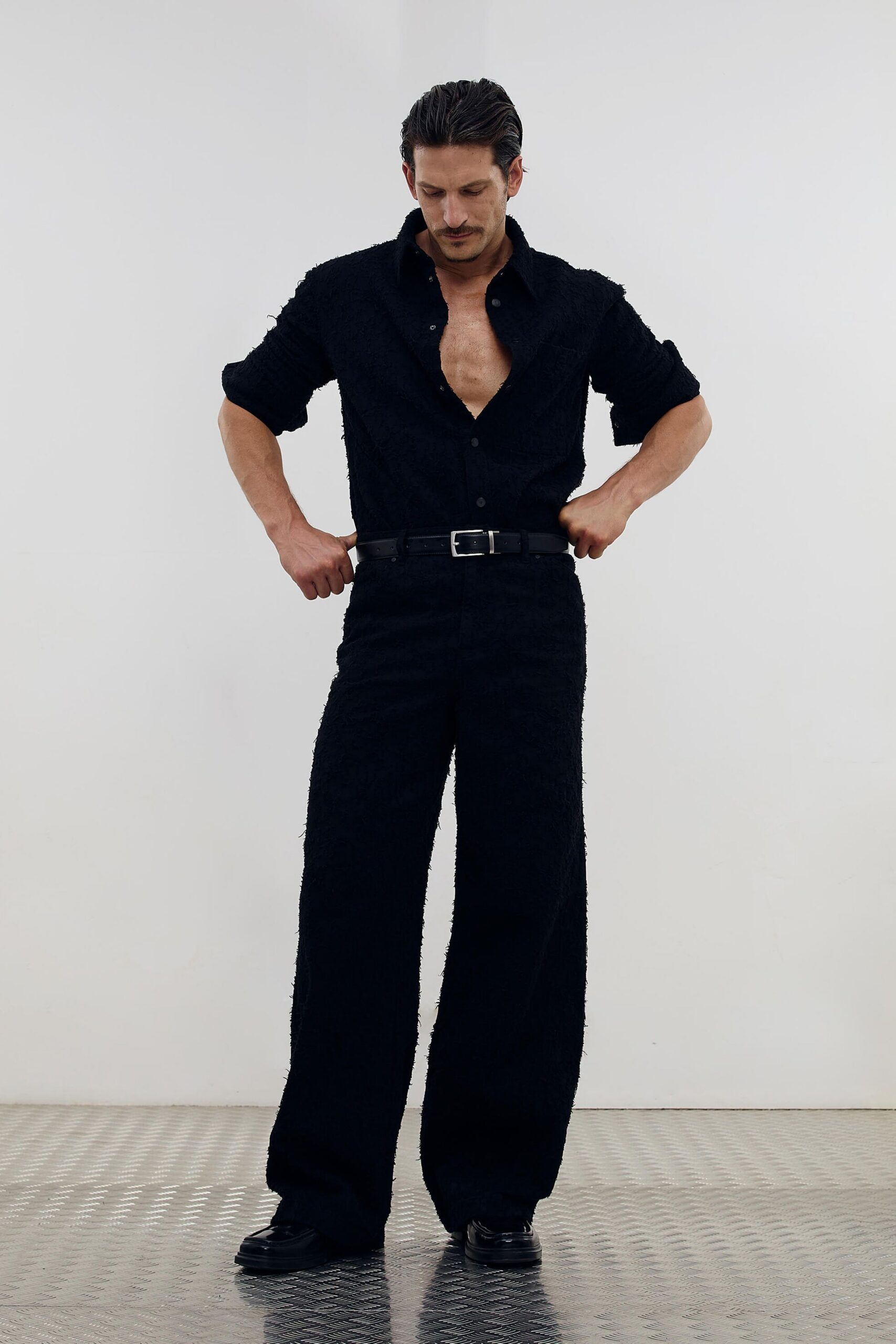 black fitted shirt and relaxed pants