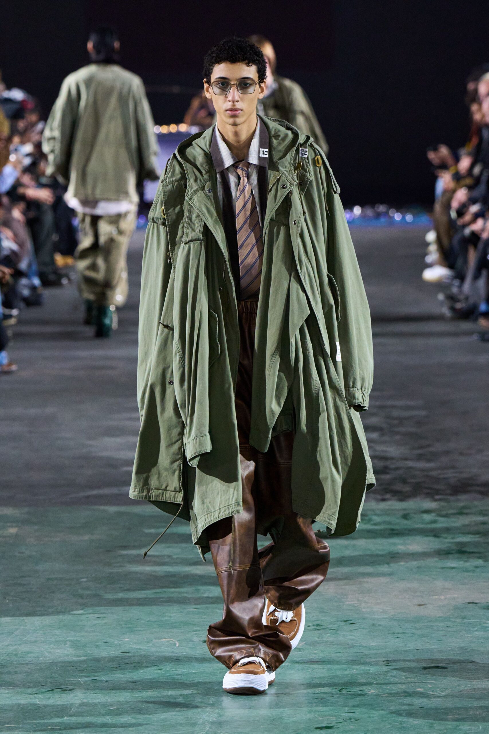 oversized green coat with brown pants