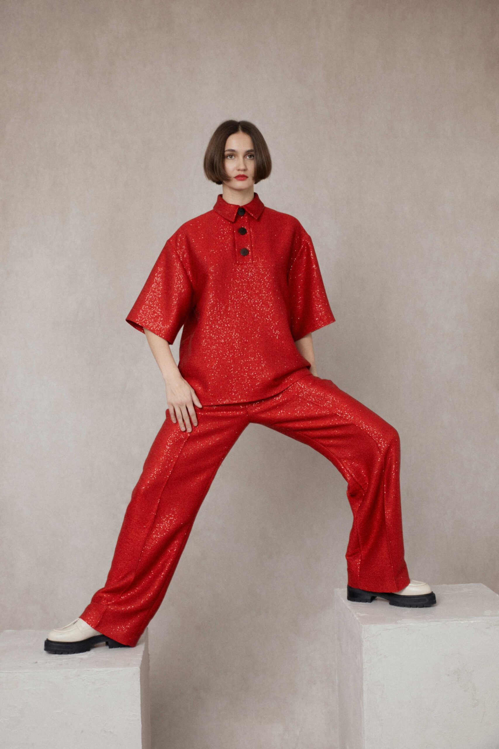 red silk short-sleeve collared relaxed textured shiny top