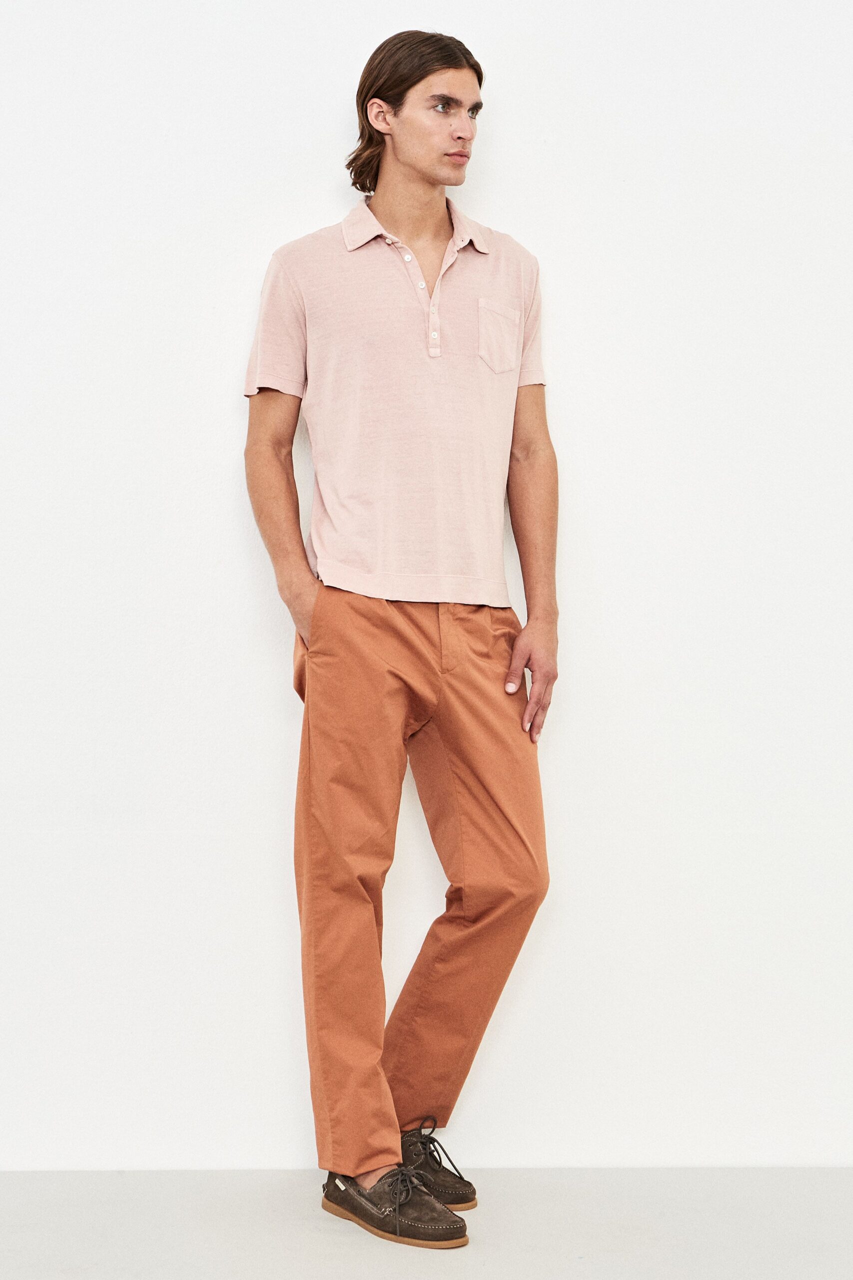 pink shirt orange pants brown shoes