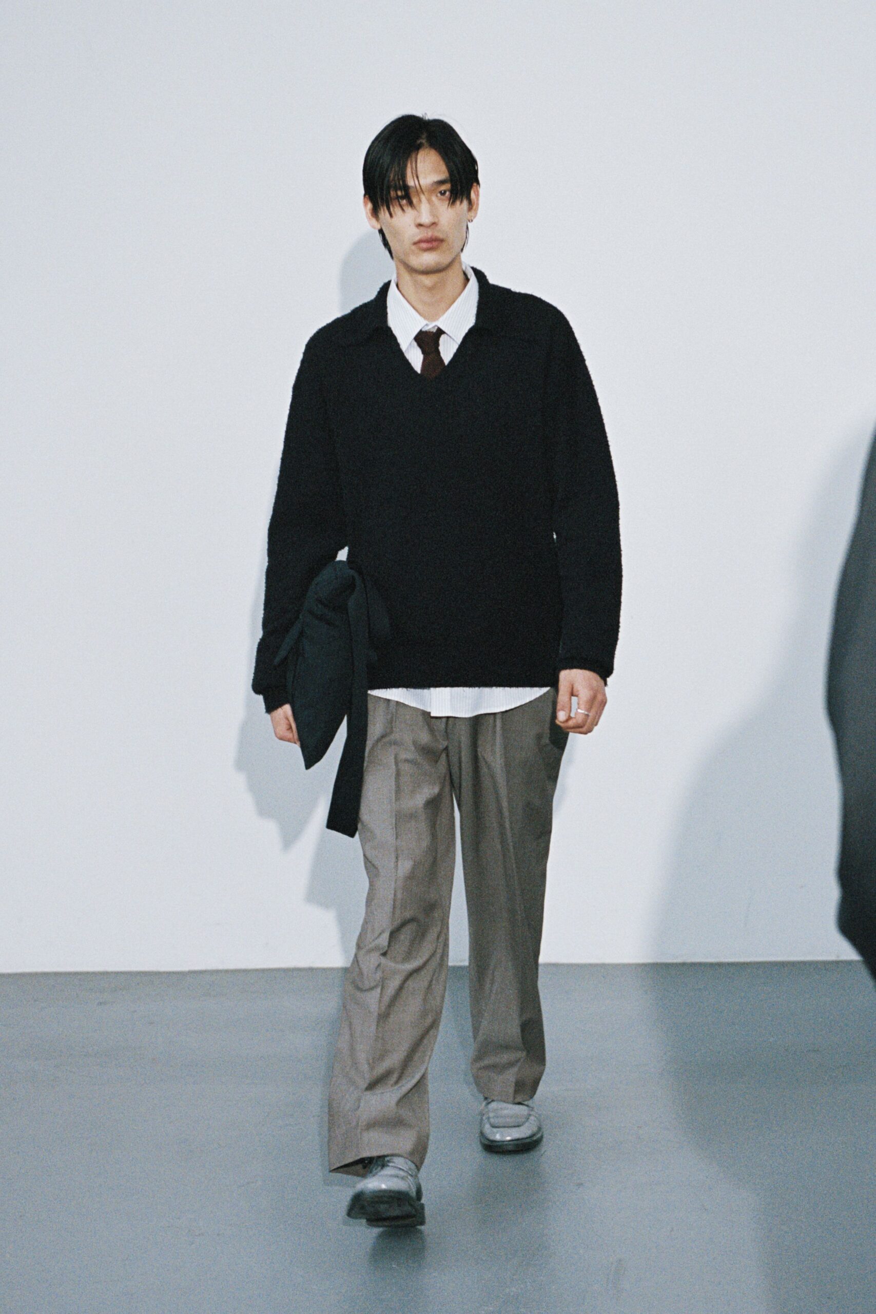 black wool sweater with gray pants