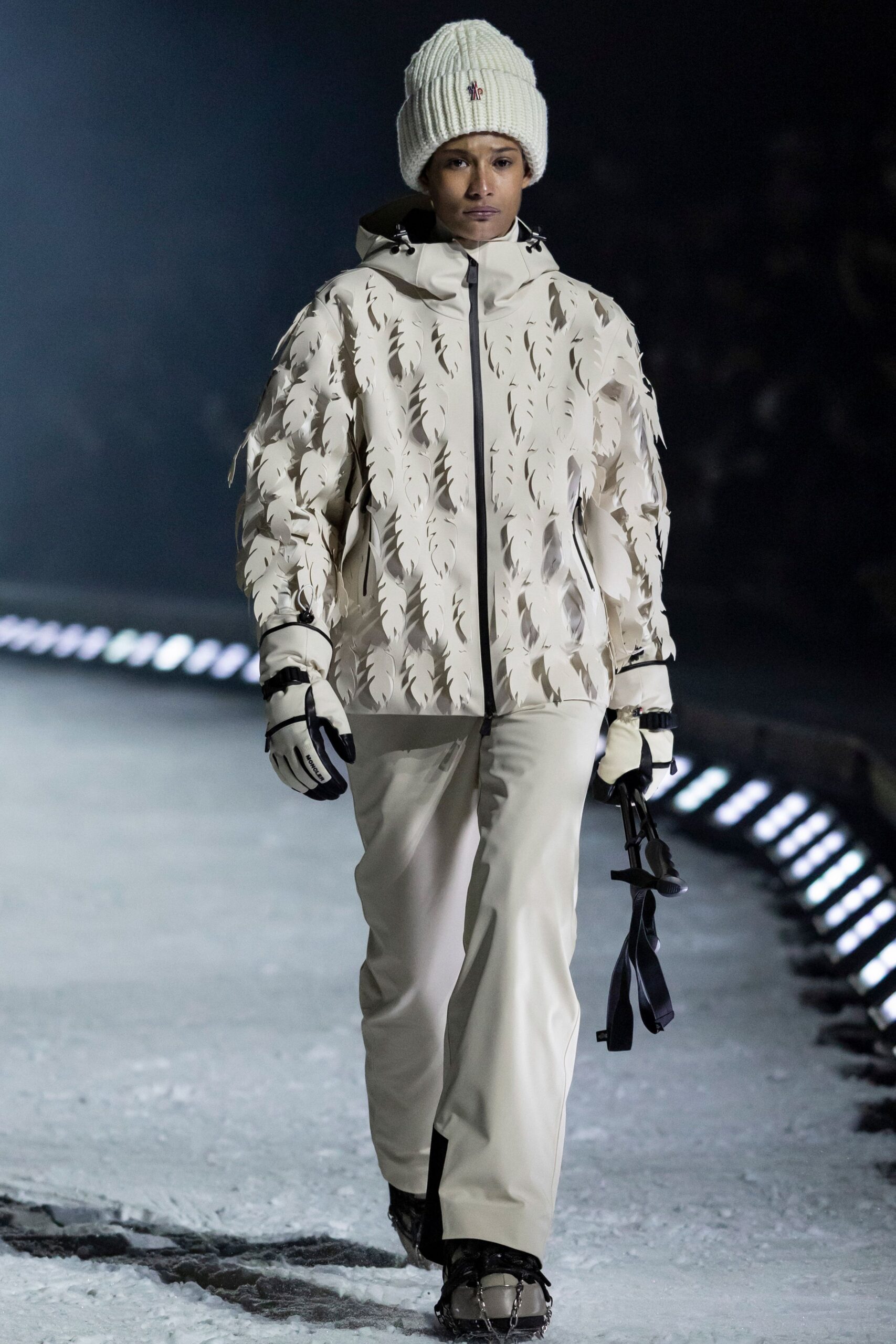 white faux-fur jacket with beige pants