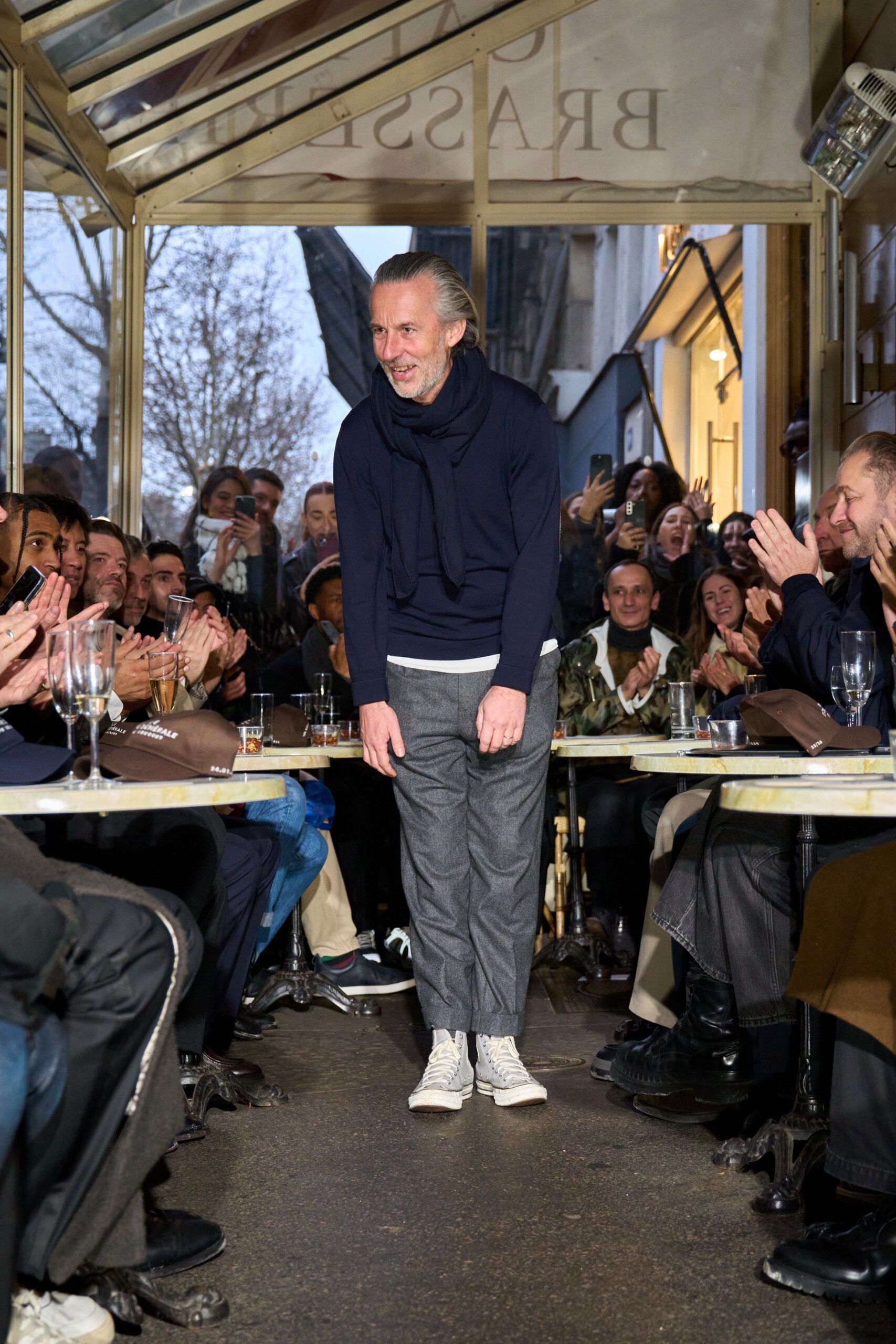 navy sweater gray pants white shoes