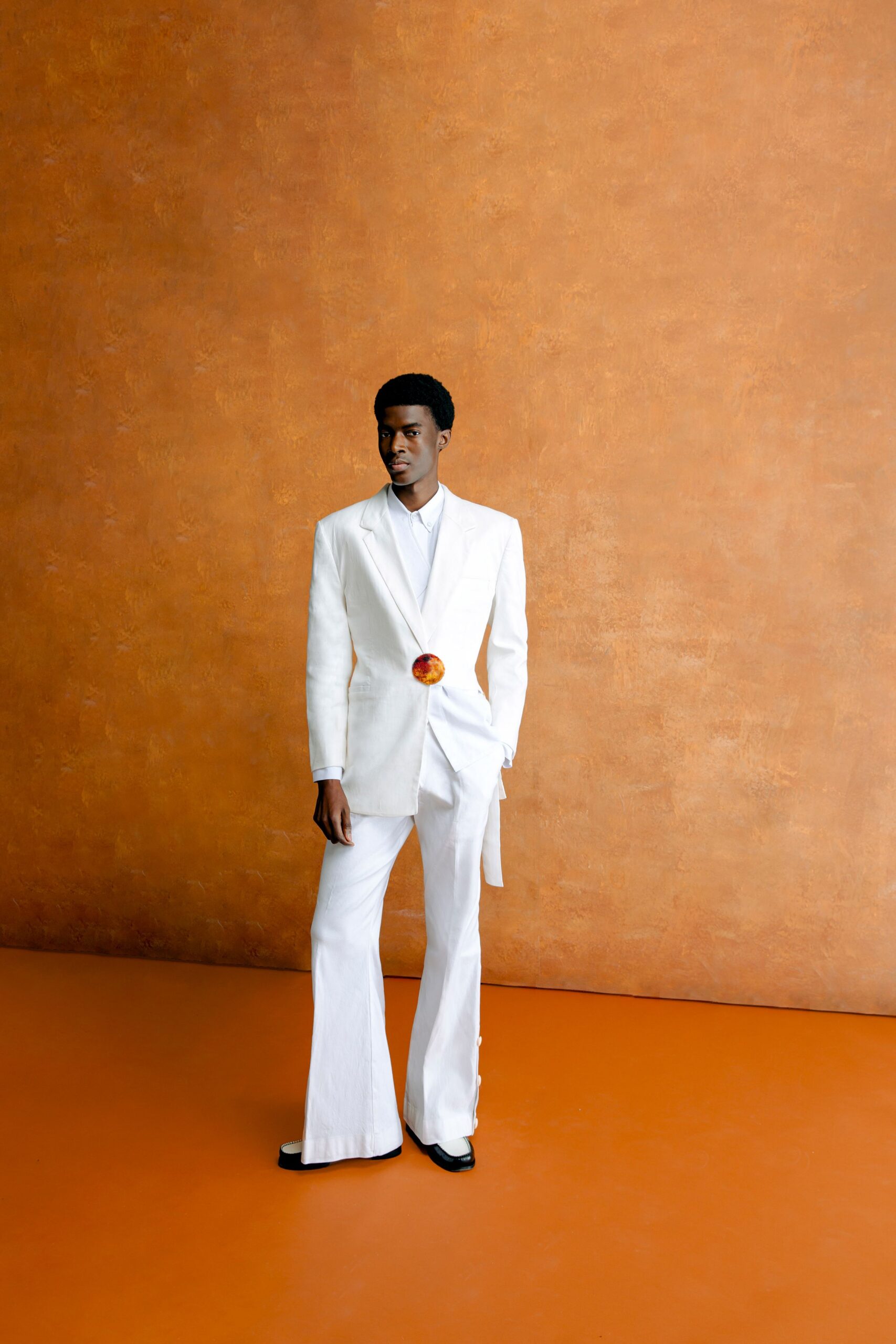 white cotton long-sleeve collared tailored buttoned flared suit