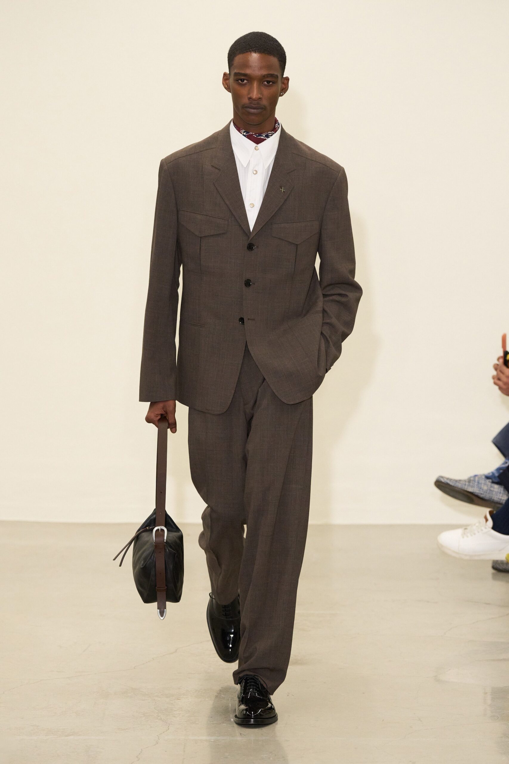brown tailored suit with white shirt