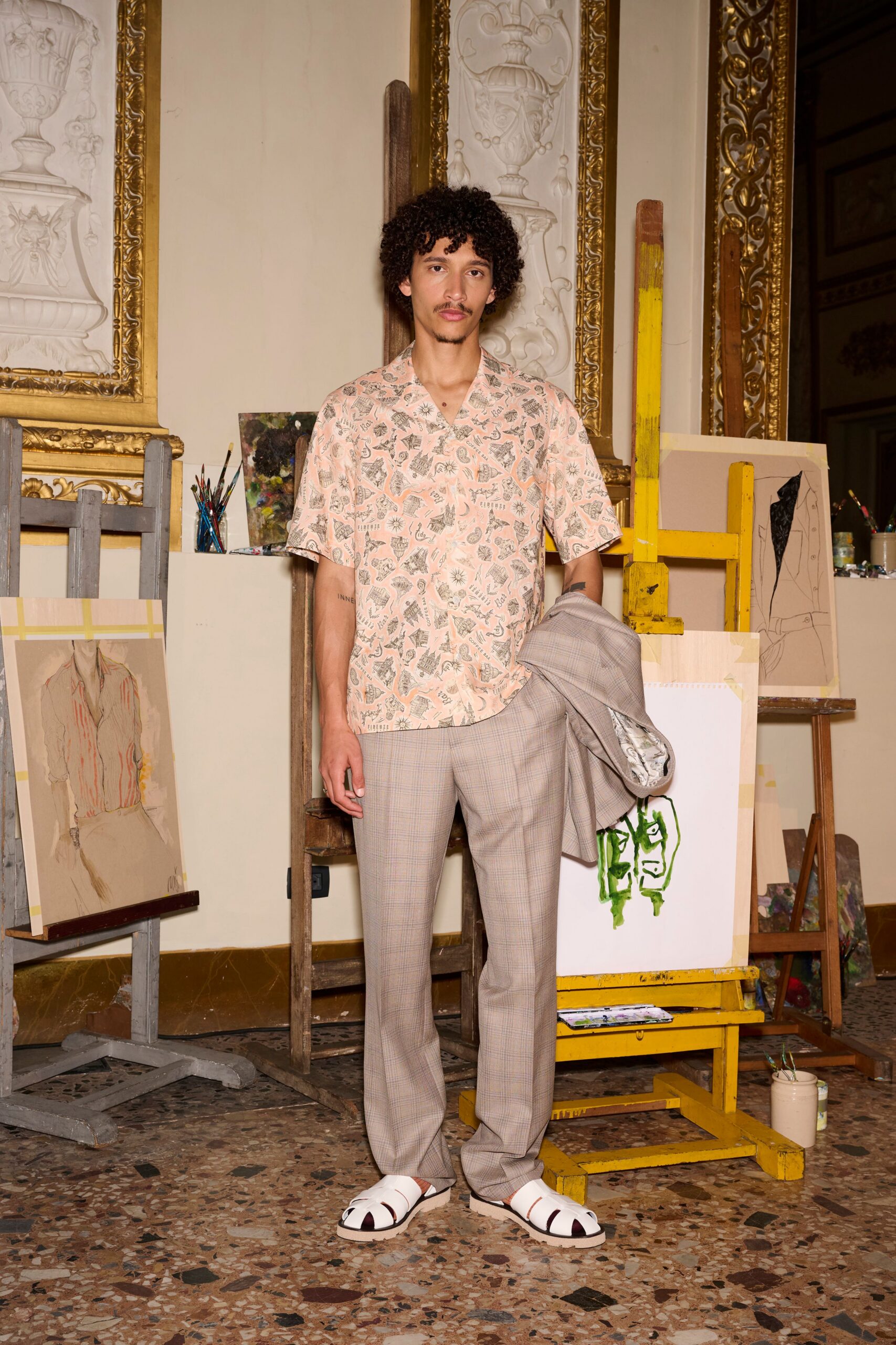 beige floral shirt with gray pants