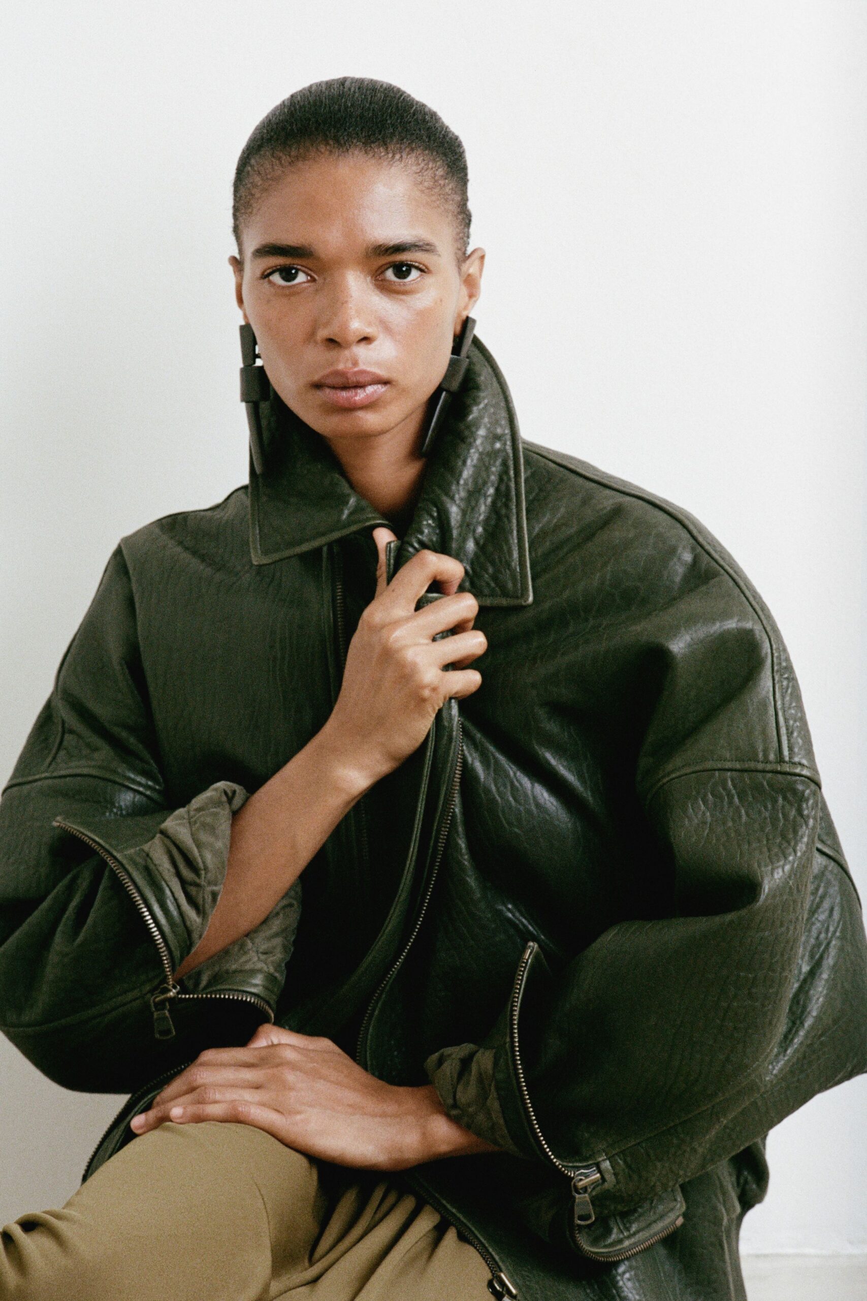 green leather long-sleeve collared oversized zippered jacket