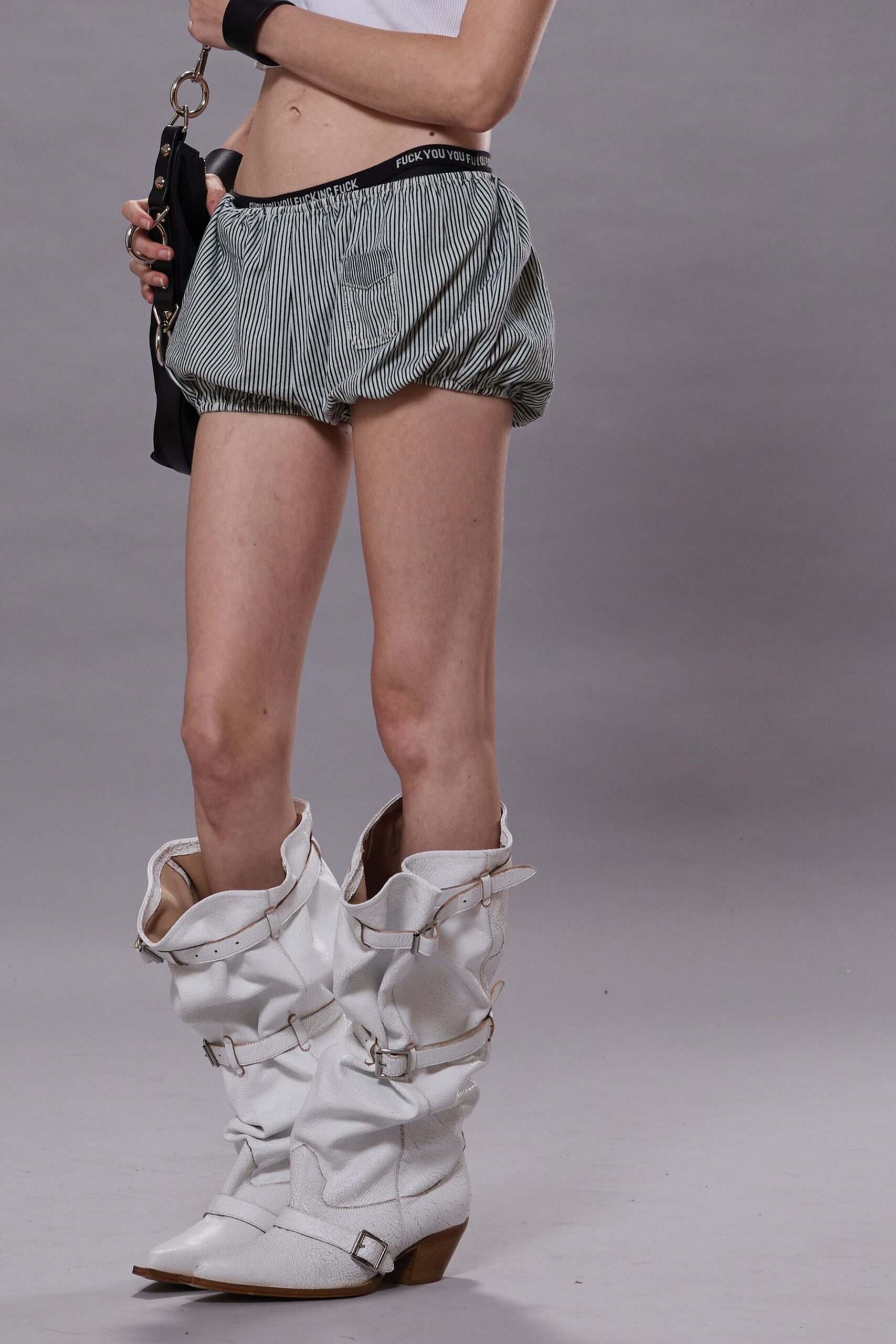 black and white striped shorts with white boots