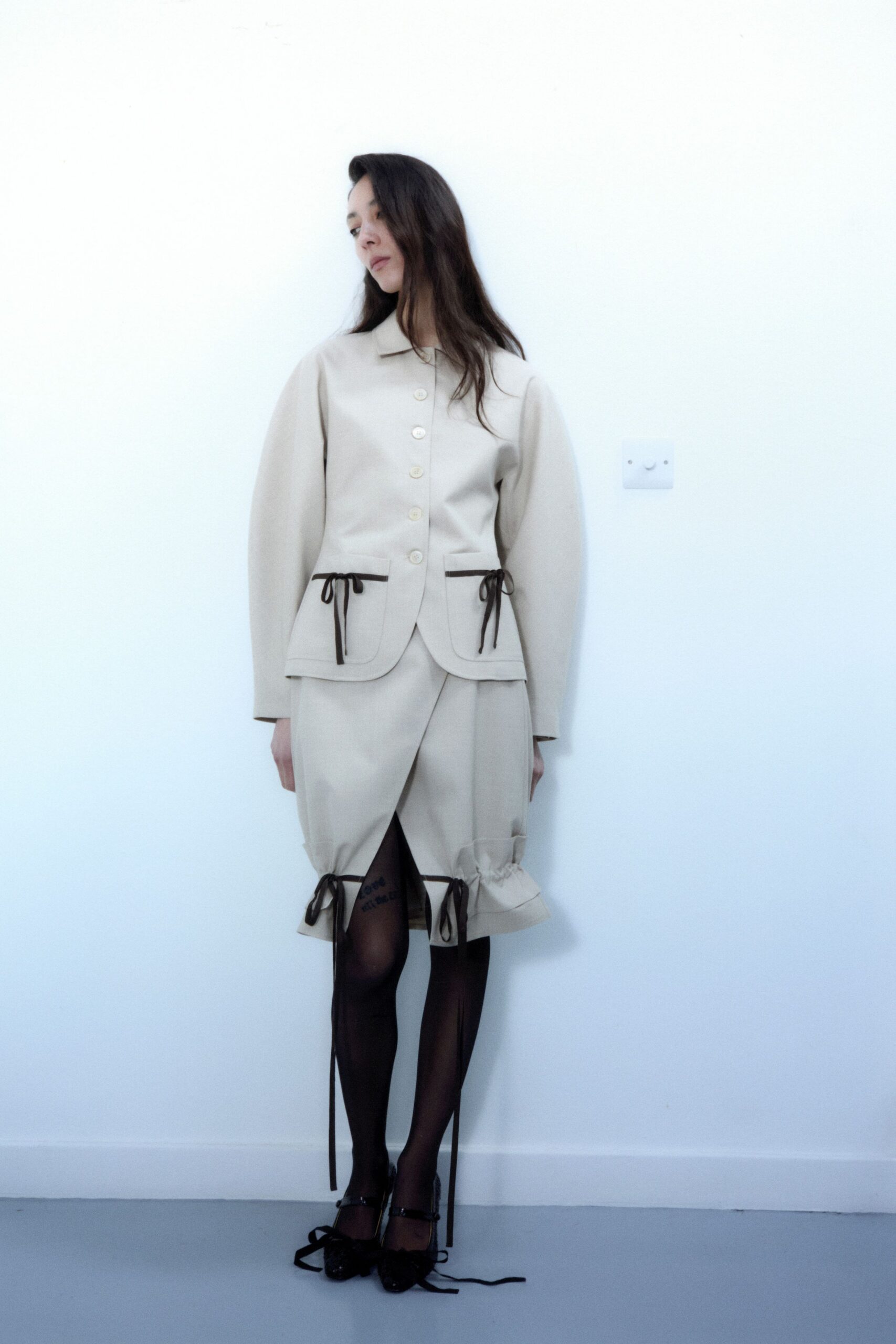 beige blazer and skirt outfit