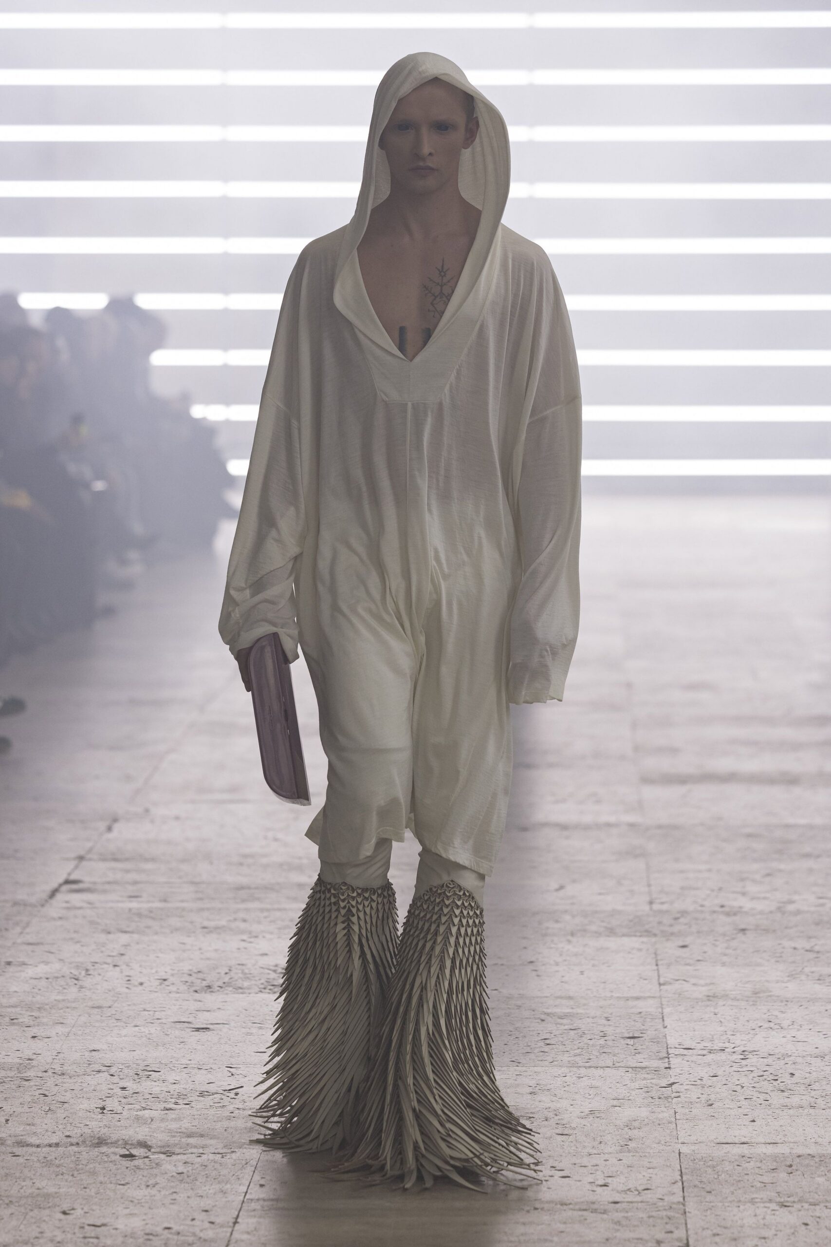 white relaxed jumpsuit with fringed shoes