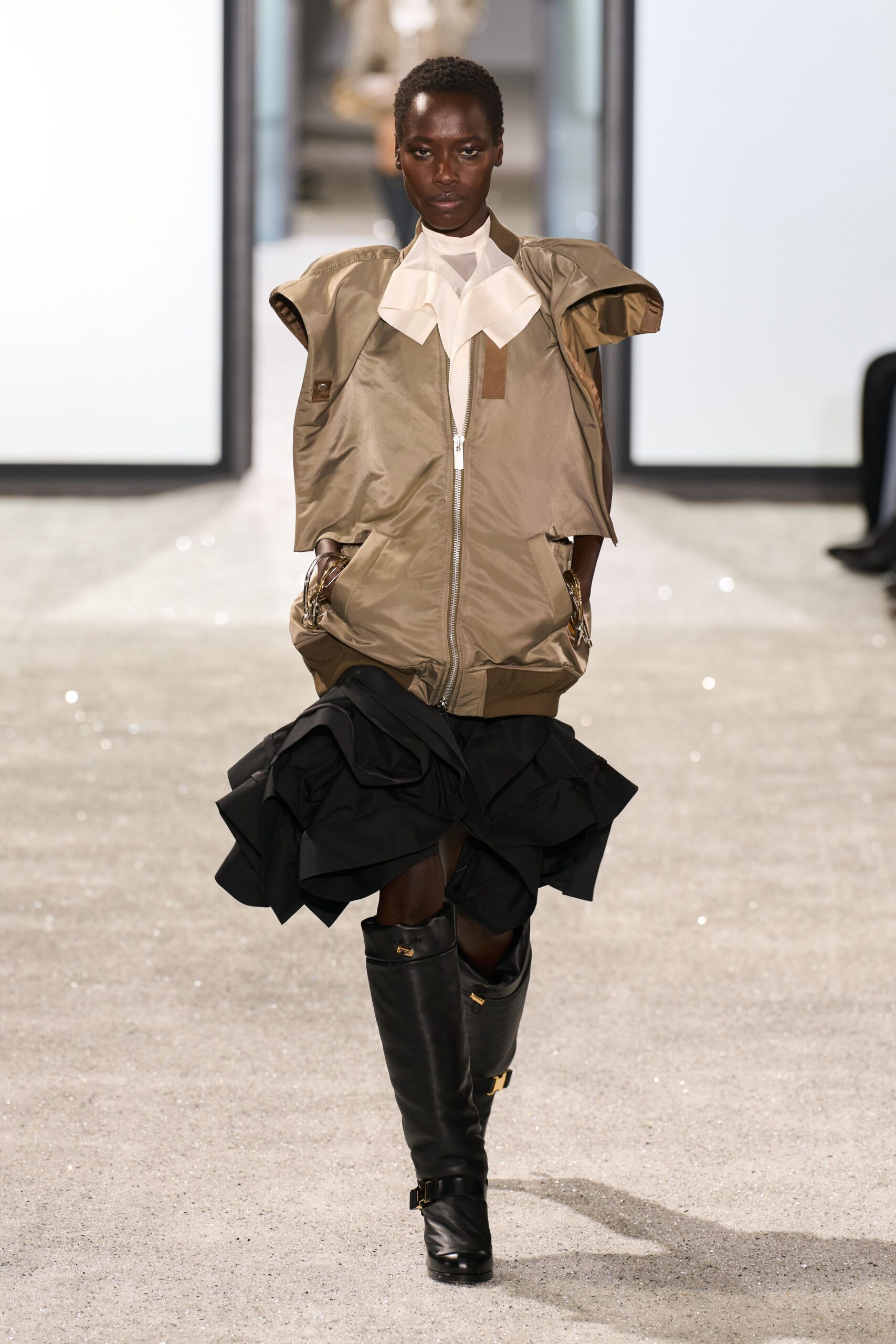 beige relaxed jacket with black skirt