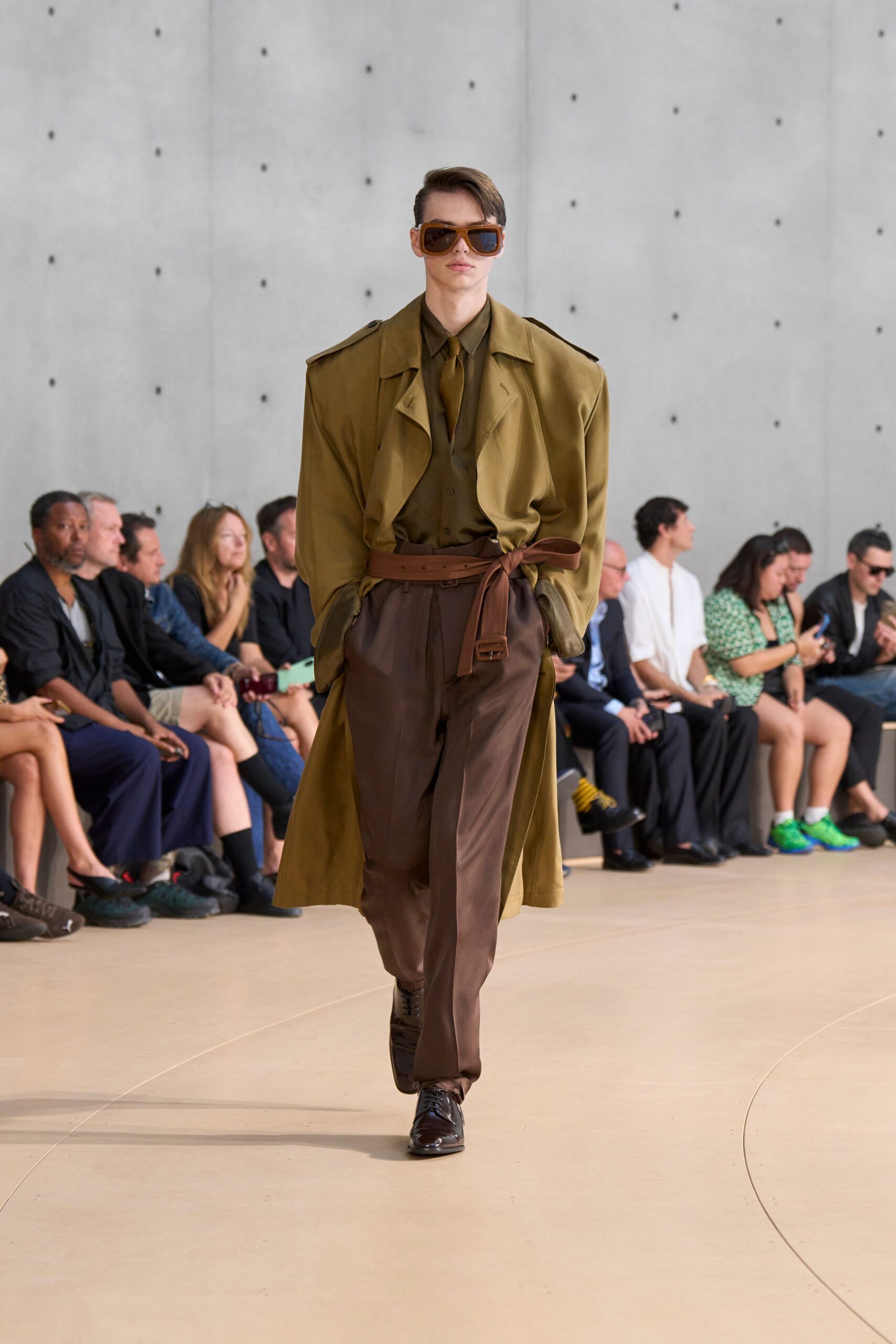 green trench coat with brown pants