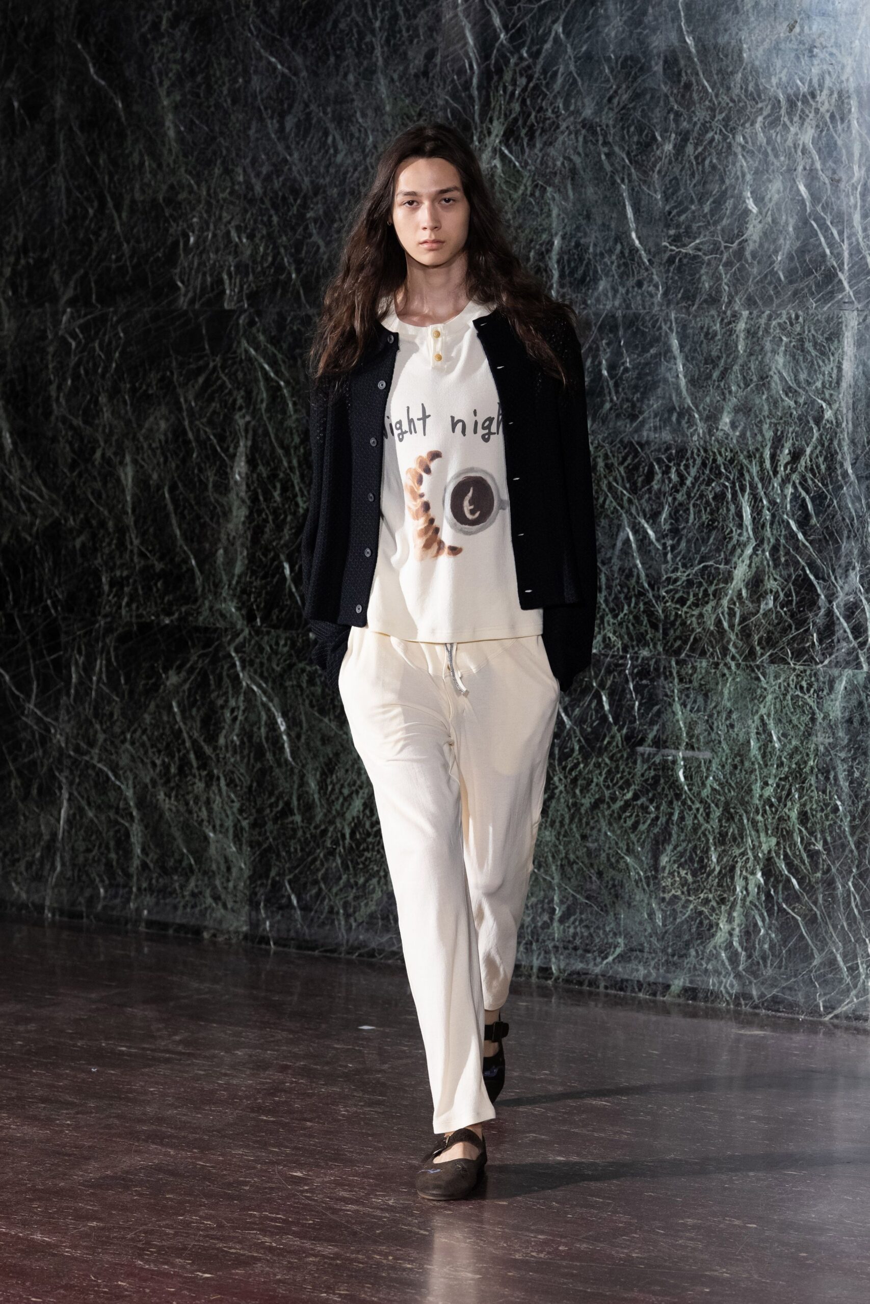 black jacket white t-shirt beige pants