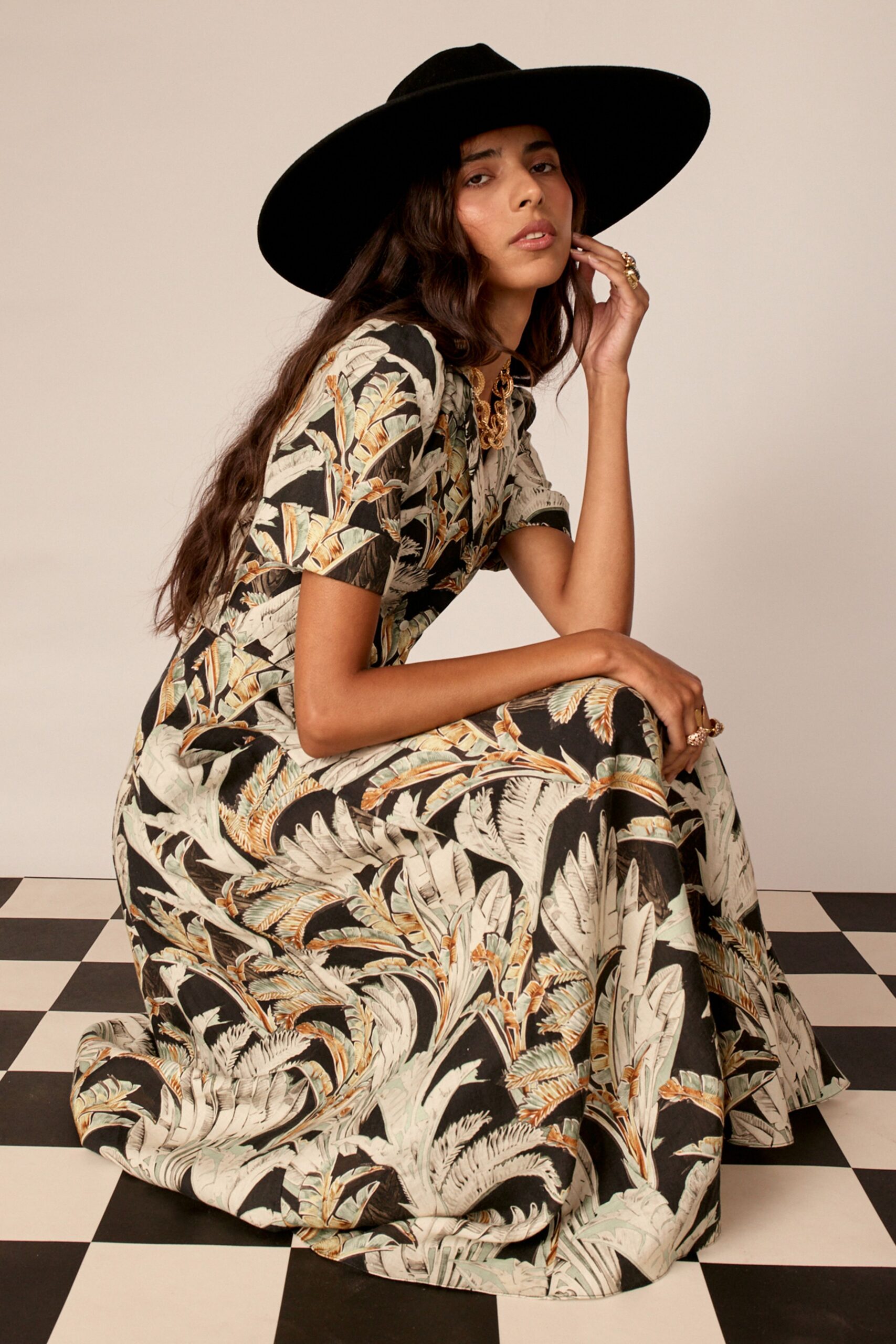 black cotton short-sleeve collared fitted floral tiered dress
