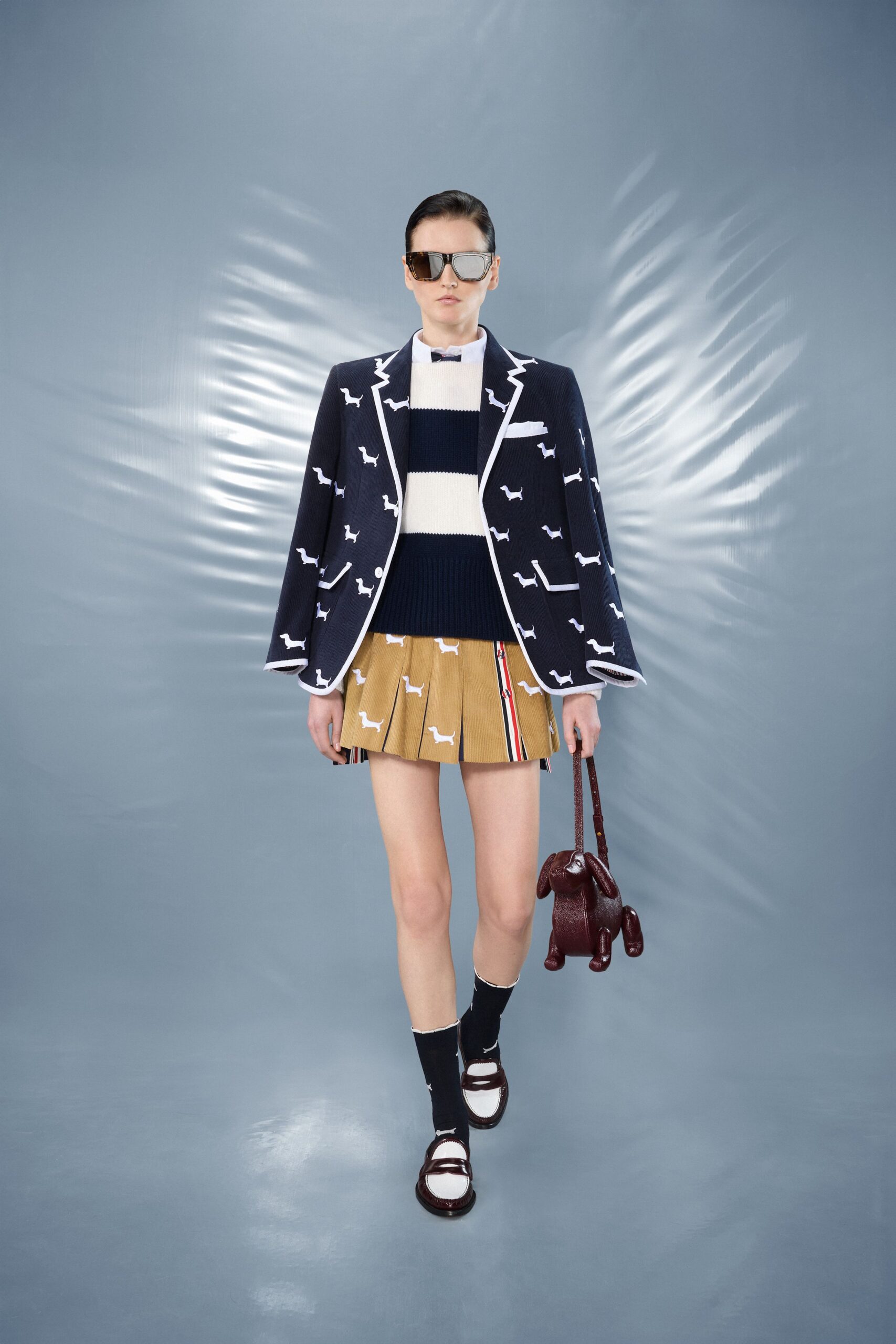 navy blazer with pleated skirt