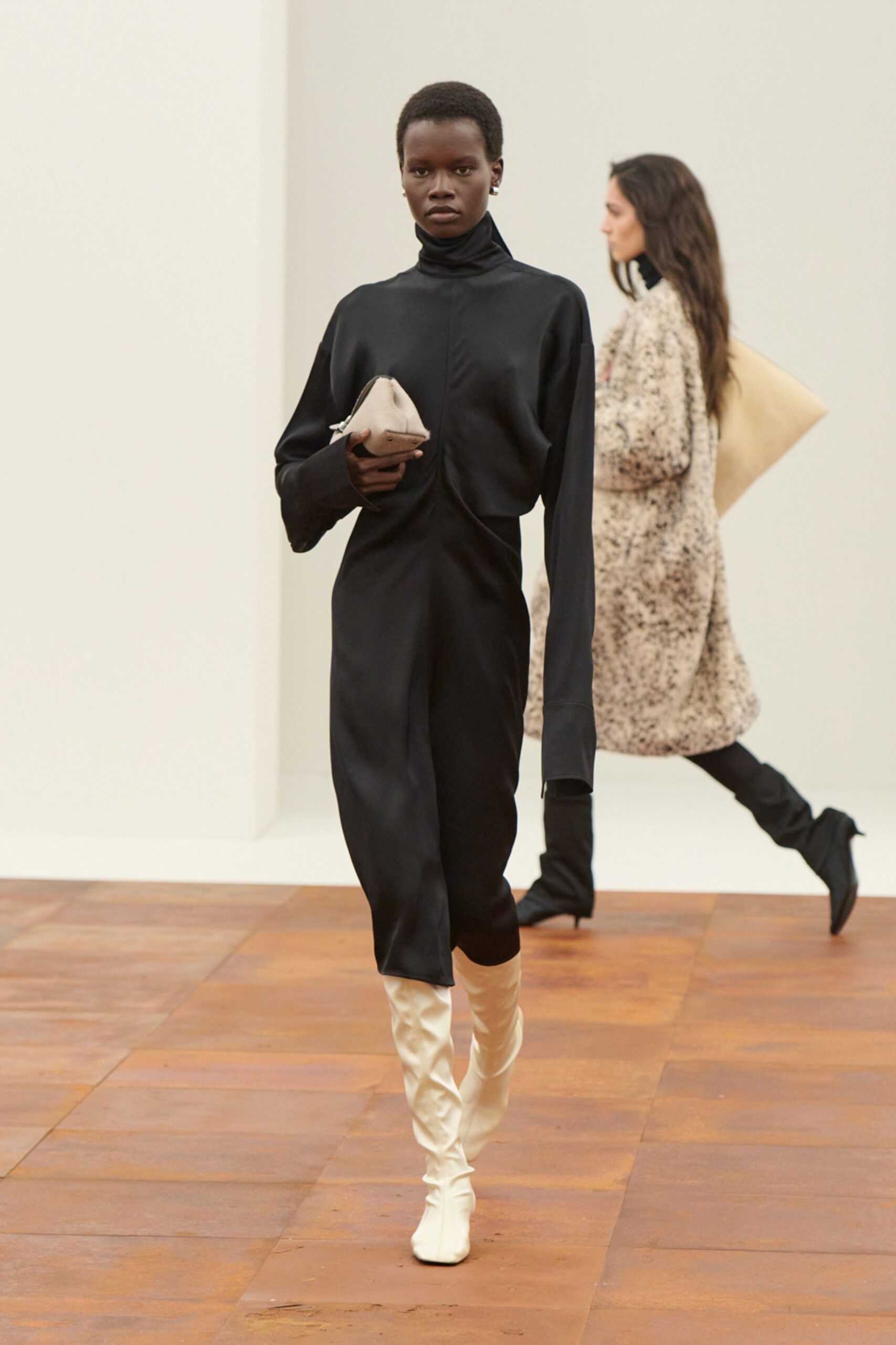 black silk fitted dress with white boots