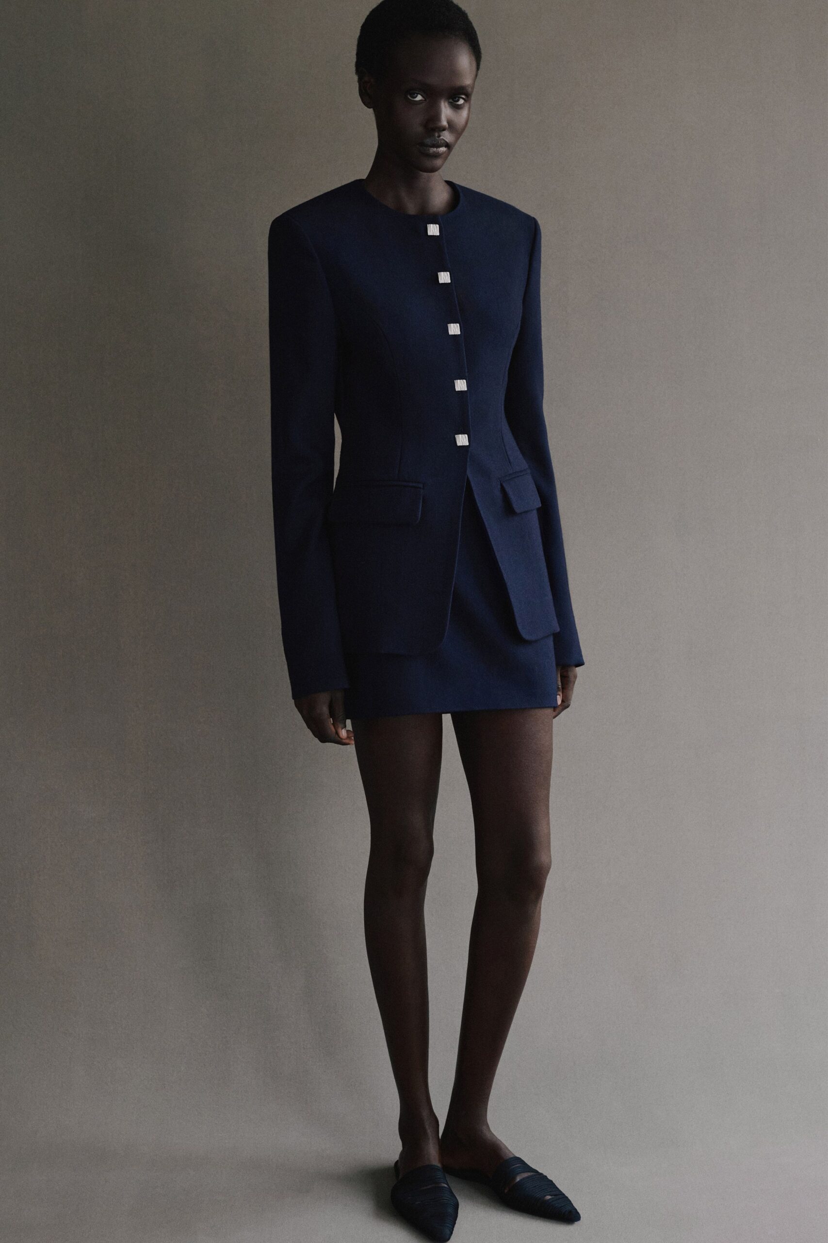 navy tailored blazer with mini skirt