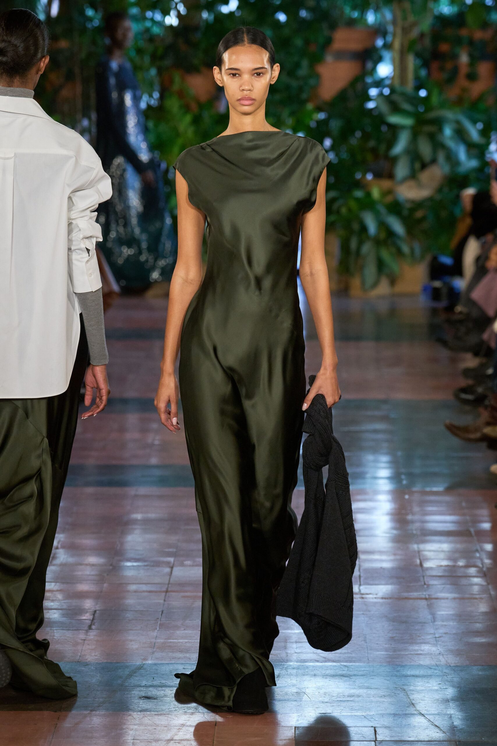green silk sleeveless high-neck fitted draped flowing gown