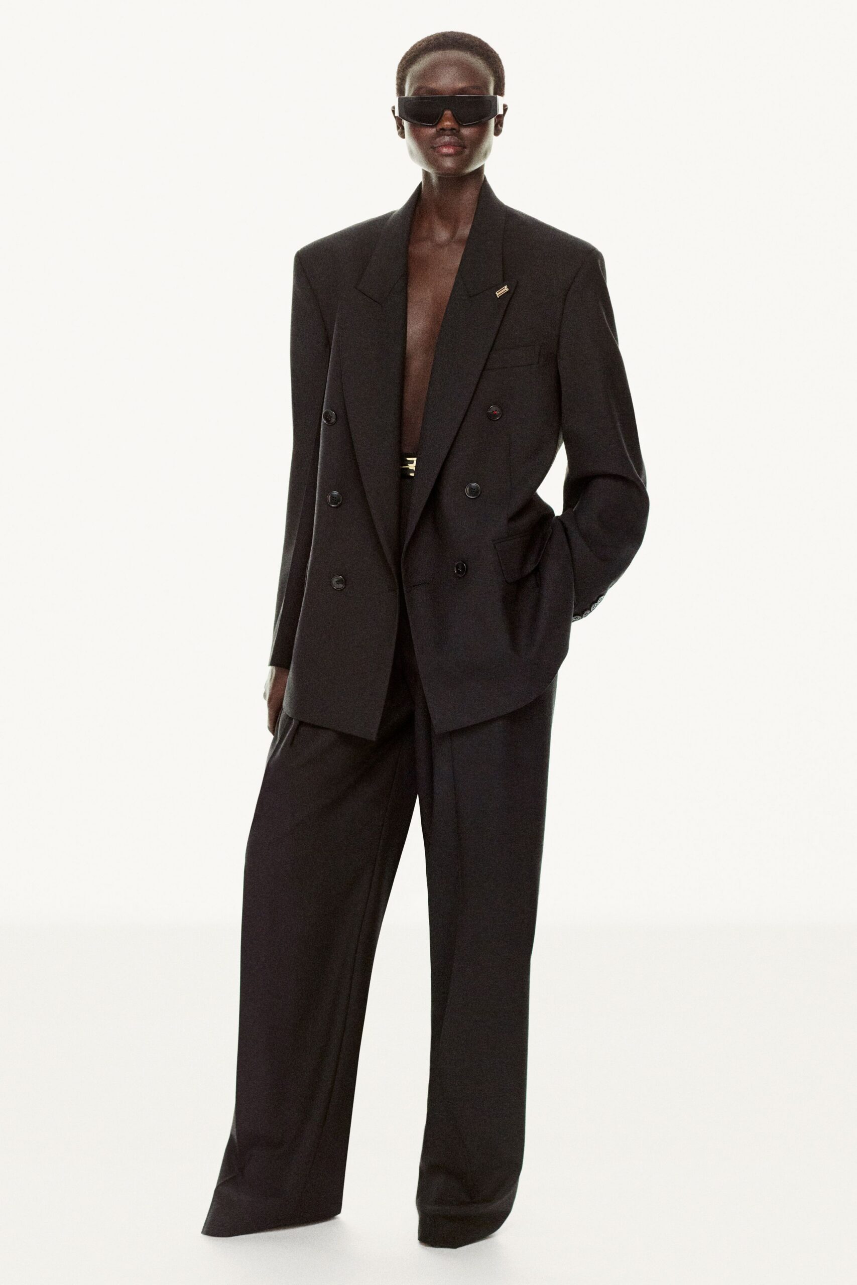 black tailored suit with sunglasses