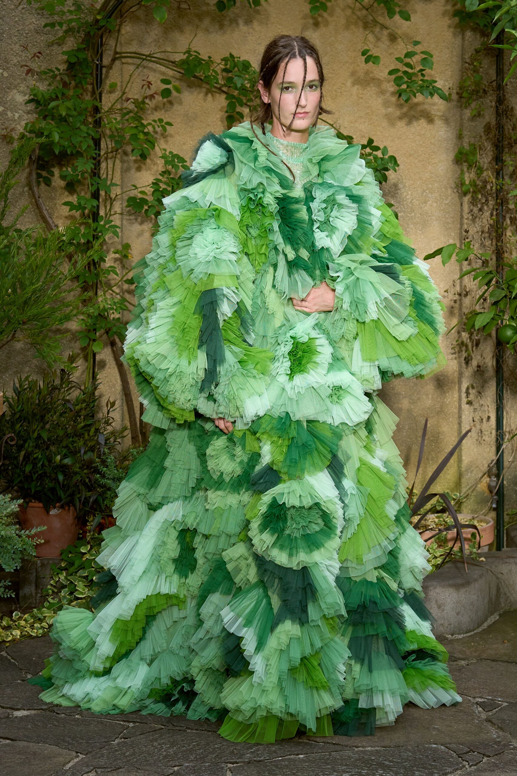 green pleated flowing gown