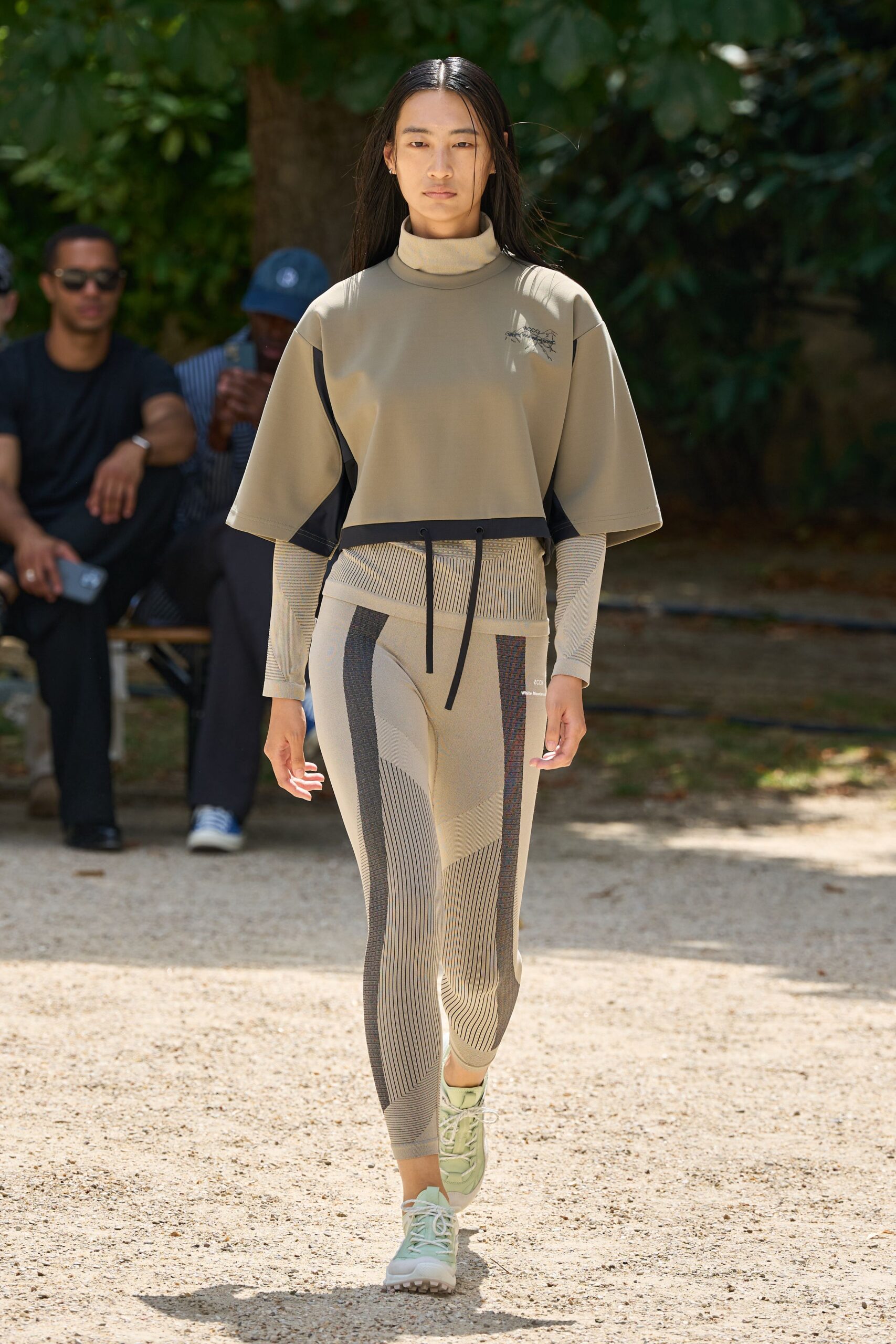 beige fitted top with striped pants