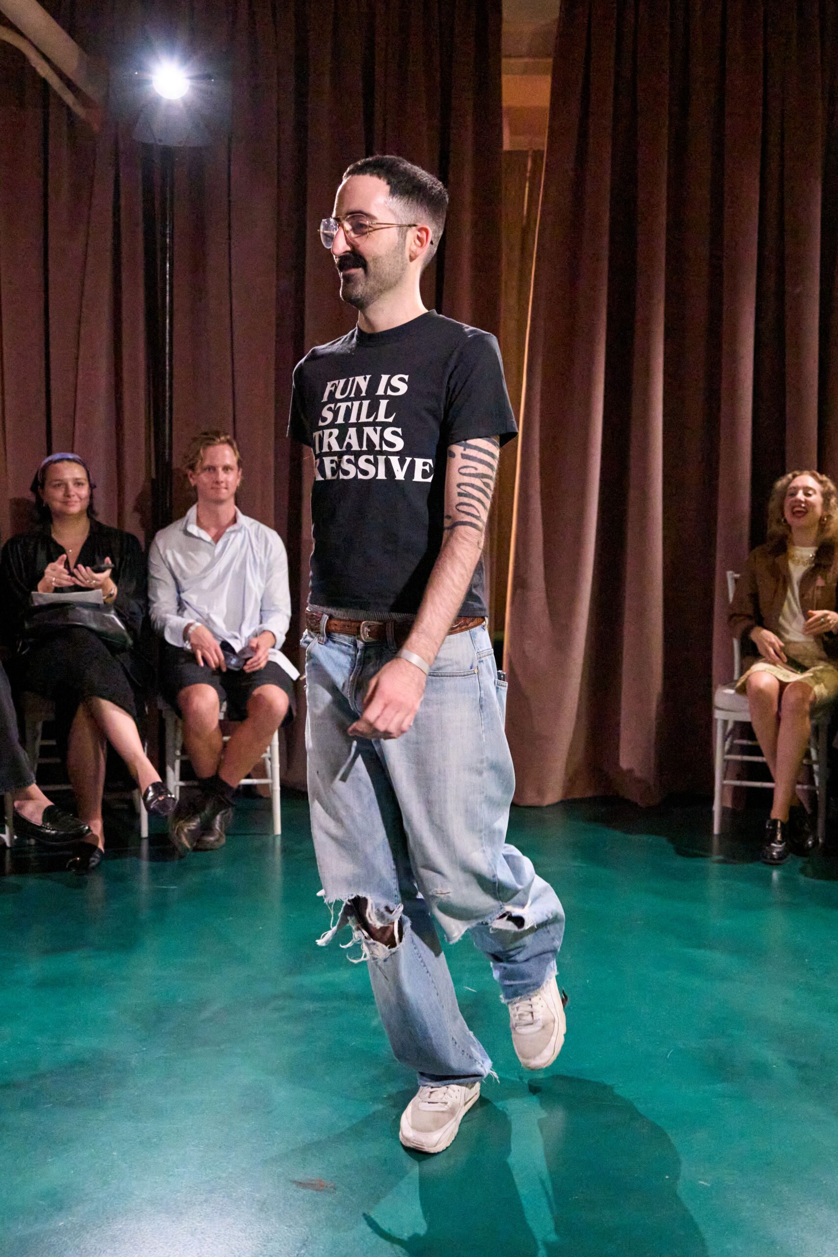 black t-shirt blue jeans white shoes